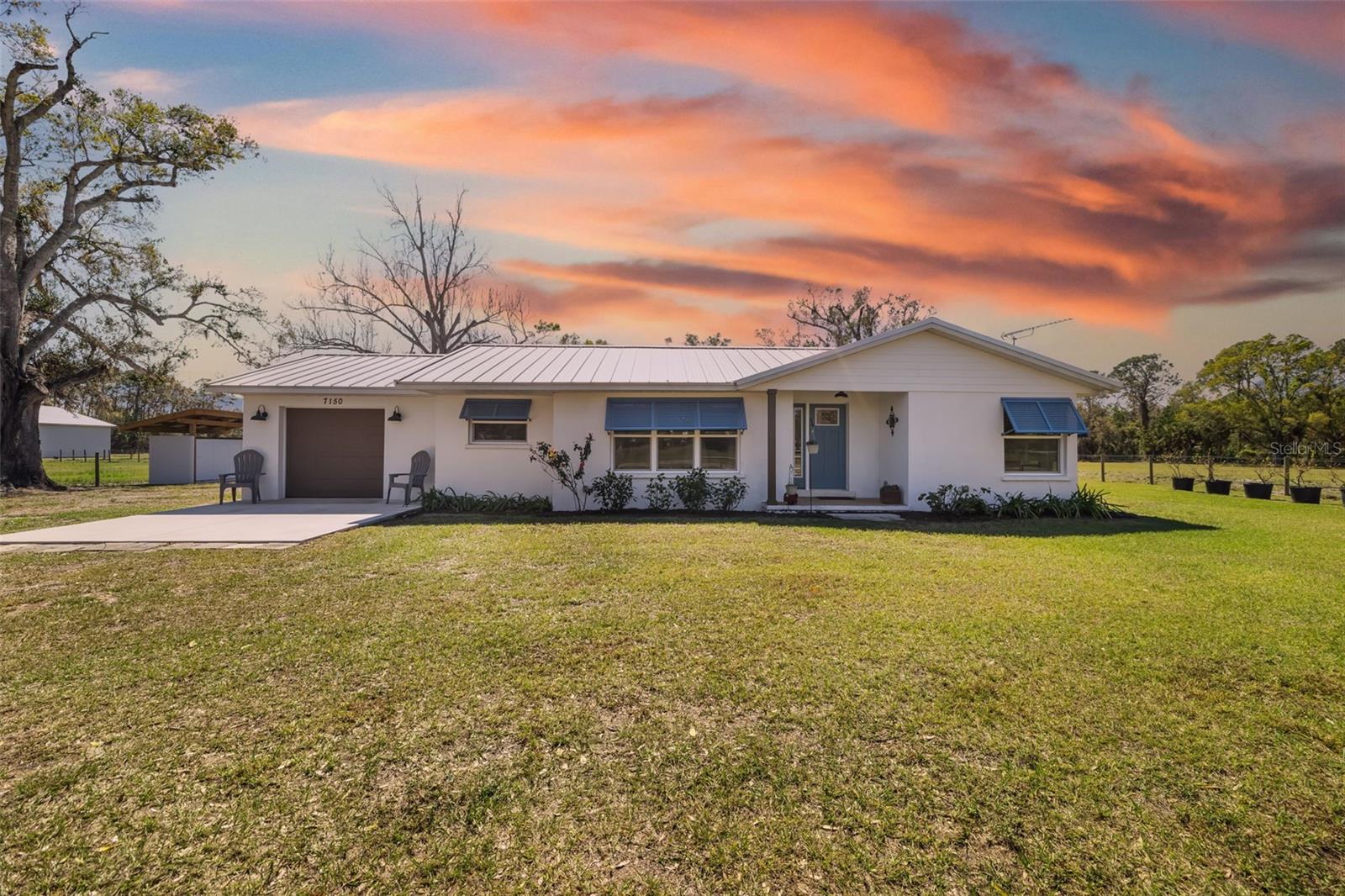 This unique property offers endless opportunities for income or a family estate. On 10 acres of agricultural-zoned land with low taxes, it boasts a fully remodeled three-bedroom, two-bath home, a versatile 10,200-square-foot pole barn with 50-by-50-foot enclosed shop and 13 RV spaces. Here's what makes this property standout, home is three bedrooms, two baths and 1,800 square feet. Fully remodeled down to the block walls just two years ago. Upgrades include new electric, LP gas, plumbing, windows, doors, a durable metal roof and spray foam insulation for energy efficiency. Energy efficient with LP gas tankless water heater and appliances. Potential rental income. Pole barn & RV spaces 12-by-50-foot pole barn designed to house Class A RV with electric, with its electric meter, plumbing, LP gas and roughed-in office, bath and kitchen. With 13 RV/boat spaces that can generate potential monthly income. Ample storage and build-out potential. Land and zoning, 10 acres of fenced agricultural-zoned land with*dividable potential into two five-acre parcels. Leasable for cattle to keep taxes low. Great location with income potential. Whether you’re looking for a potential income-generating property, a family estate or a place to put your small business. 7150 Richardson Road has it all. Schedule your showing today and explore the possibilities!