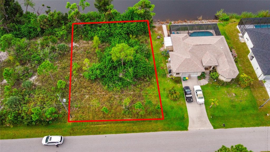 Photo of 15149 Amsterdam Avenue, Port Charlotte, FL 33981 (MLS # TB8430430)