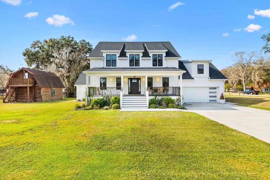 Welcome to this stunning modern Craftsman-style 3BR/2.5BA 2,244+/-SQ FT home, located along the tranquil banks of a private canal. With its timeless design, exceptional craftsmanship, and breathtaking water views, this home offers the perfect blend of elegance and comfort. The canal leads out to The Withlacoochee which spans all the way to the Gulf of Mexico and connects to Lake Panasoffkee. Known for its massive 4,460 acres, Lake Panasoffkee offers a perfect blend of rural settings with various activities such as fishing, trails, swimming, boat rides, and so much more. Located right off SR 44 this home is centrally located to The Villages, and within minutes of Citrus County, shopping, dining, entertainment, and much more. Featuring an open-concept living spaces, intricate wood detailing, and an inviting layout, every inch of this home has been thoughtfully crafted to create a warm, welcoming atmosphere. This impressive 3BR/2.5BA home is comprised of a BONUS OFFICE, inside laundry room, cover rear and front porch, 2-car garage, a attached storage shed, and a massive finished 346 SQ FT loft/bonus room located above the garage perfect for your man crave or an extra room.(NOT INCLUDED IN HEATED AREA BUT JUST NEEDS AC). Newly constructed in 2023 the home features a mono slab and stem wall foundation, vinyl board and batten siding, spray foam insulation, an outdoor shower, a paver patio and so much more. Stepping inside you are greeted with LVP flooring throughout the home with recessed lighting, 2-panel doors, 5" baseboards, and an inviting open layout floor plan. The kitchen features stainless steel appliances, shaker cabinetry, stunning quartz countertops, tiled back splash, under cabinet lighting, a gorgeous molded exhaust fan, and built-in table counter top. Overlooked by the kitchen the living room is spacious with a guest half bathroom with plenty of windows allowing an ample amount of natural lighting. The master bedroom is stunning with sliding door access to the porch, with the suite featuring a walk-in closet with built-ins, a private lavatory, tiled walk-in shower, and a vanity with tiled back splash. Walking up the elegant staircase accompanied by a chandelier, the second story of the home features a loft area, a dedicated office, a storage room, and the bedrooms. The spare bedrooms are just as impressive with walk-in closets, and a shared full bathroom. Just as it couldn't get any better, the backyard offers a covered patio, with a massive paver patio enclosed by a vinyl privacy fence perfect for entertaining. The 175 SQ Ft attached storage features the well with a water filtration system for crystal clear water.  With its prime canalfront location, high-end finishes, and spacious, light-filled interiors, it truly represents the perfect place to create lasting memories. Whether you're enjoying serene water views from your porch, hosting gatherings in the expansive living areas, or retreating to the peaceful sanctuary of your private spaces, this home is a rare find that promises both luxury and tranquility. With too many features to name, this home is a showstopper and a must-see in person to appreciate! So Call Today and Schedule Your Private Tour!