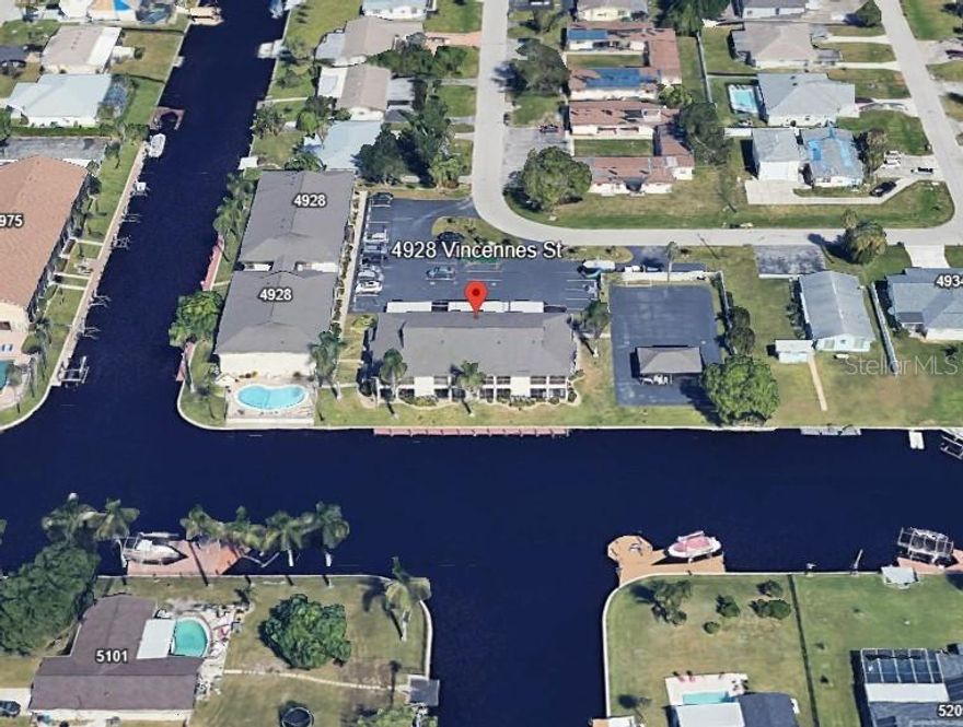 Waterfront, Gulf Access Condo with Dock!  This is one of the best kept Gems in South Cape Coral. Le Grand Marquis Condos not only has a great location and amenities, but also some of the best residents of SW Florida. This 1st Floor Unit has been well maintained and mostly remodeled with lots of New Features, including A/C, Paint, Flooring, Cabinets and Counters. But most Spectacular is the Waterfront View as soon as you walk in the door. This South facing view of the Intersecting canal leads out to the Gulf with a short boat ride. Keep your Boat at the Community Dock and enjoy a dip in the Heated Community Pool, as well as Coffee and/or Margaritas at the Community Cabana/Pavillion. This Beautiful Condo features 2 Bedrooms plus an Office/Den area, and a Lovely Kitchen with the Beautiful View of the Water! A Large Lanai features Sliding Doors from the Living area and MBR, Storage and Laundry, Screen and removable Plexi-Windows along with the Incredible Vast View of the Water. Watch the daily Wildlife and frequent Dolphin & Manatee visits from your Lanai, Dock, and Pool. The Master BR is spacious and has awesome views, along with a large walk-in closet. This condo is in the highly desired SE Cape Coral. It is a short walk to Grocery, Markets, Shops, Restaurants and more. And a short drive to the Wonderful Beaches of SW Florida.