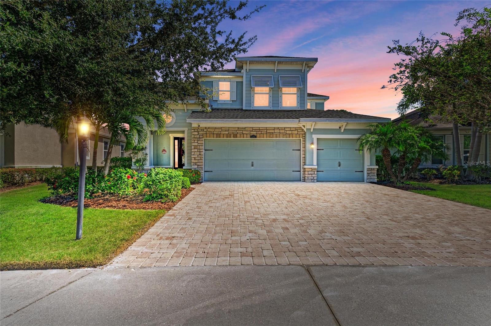 This impeccably updated residence blends refined style with a premier location close to the best of Lakewood Ranch and Sarasota. Boasting three bedrooms, two and a half bathrooms, an office and a spacious three car garage, the home is perfectly positioned on a serene cul-de-sac. The exterior showcases modern color tones, elegant stone accents and lush landscaping that elevate its curb appeal. Inside, a welcoming foyer and formal dining area lead to rich wood floors that flow into a bright, open great room, kitchen and breakfast nook. The kitchen is a true chef’s delight with dazzling quartz countertops, white cabinetry, stainless steel appliances and under cabinet lighting. The primary suite, conveniently located on the first floor, provides a luxurious retreat with a soaking tub, walk-in shower and an expansive custom walk-in closet. Upstairs you will find two additional bedrooms, a loft, a den with glass French doors and a full bathroom with double vanities. Recent updates mean you can move in without lifting a finger. The interior has been freshly painted, a new AC added and the exterior has a new fence and roof replaced in 2025. A whole home reverse osmosis system also adds peace of mind. Step outside to your private backyard oasis where a sparkling saltwater pool awaits. Surrounded by a generous covered lanai space overlooking a tranquil pond and nature preserve, this retreat features upgraded pool equipment including a new pump, panel, salt system, filter and solar thermostat. Residents of Harmony enjoy maintenance free living and exclusive community amenities including a beach entry pool with lap lanes, a well equipped clubhouse and fitness center and a playground. Set in the heart of Lakewood Ranch, this home has close proximity to restaurants, shopping, entertainment and the rich cultural experiences that make Sarasota one of Florida’s most desirable places to live.