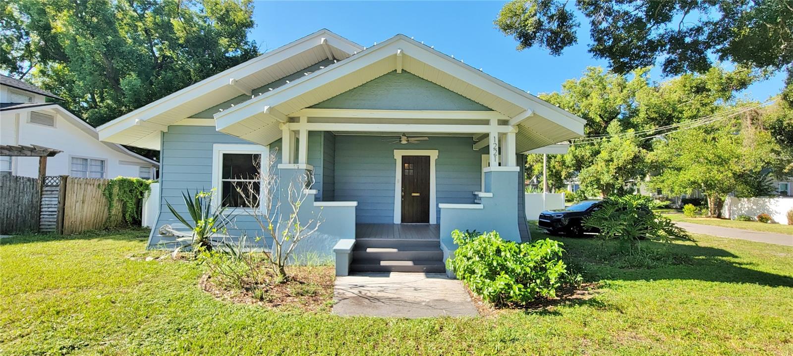 Charming & cozy bungalow-style 3 bedroom, 1 bath home on an over-sized lot. Beautifully updated interior to include vinyl plank flooring throughout, new windows & more! The living area is flooded with natural light with original brick fireplace in the dining area. Modern kitchen featuring white cabinets, ALL stainless steel appliances & a WALK-IN PANTRY. The spacious bathroom has also been updated with a double-sink vanity, mirrors, light fixtures & offers a closet cabinet for additional storage. The laundry room comes equipped with full sized washer and dryer & provides closet space for the 3rd bedroom. This house sits on a double-sized corner lot with a COMPLETED FENCED BACKYARD and open wood deck. This house is ready for you to make it your new home! Pets with owner approval. LAWN SERVICE INCLUDED! AVAILABLE NOW!!
