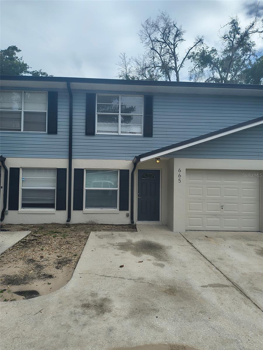 Looking to live close to Downtown Clermont? What about 2 blocks from it all. You've found the perfect property. Walk to all the shops, restaurants, and local downtown and waterfront events. This completely renovated townhouse offers 3 bedrooms, 2 bathrooms, and a 1 car garage. Freshly painted, all new luxury laminate flooring throughout and new appliances! Walking in the front door is the living room, follow through into the dining room and kitchen. The laundry closet is in the kitchen. Access the backyard area from the sliding doors in the dining / kitchen area. Upstairs you'll have the primary suite with ensuite bathroom, plus 2 more spacious bedrooms and second full bathroom. Ready for you to call home!
