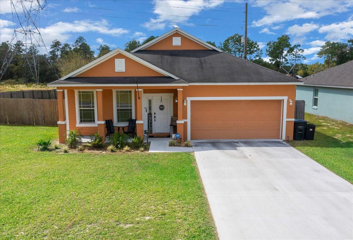 This stunning, move-in-ready home offers over 1,800 square feet of thoughtfully upgraded living space, featuring 3 spacious bedrooms, 2 full baths, and a layout designed for both comfort and style. This home welcomes you with soaring ceilings, abundant natural light, and newer luxury vinyl plank flooring throughout. Upon entry, you’re greeted by an expansive formal living and dining room combination—ideal for entertaining or family gatherings. The heart of the home is the large, open-concept kitchen, which showcases rich dark wood cabinetry, elegant crown molding, stainless steel appliances, a pantry, and a charming breakfast nook. A custom-built island with ample seating seamlessly connects the kitchen to the cozy family room, ensuring no one is left out during meal prep or entertaining. The spacious primary suite features an oversized walk-in closet and a beautifully updated ensuite bath, complete with dual vanities, granite countertops, and a walk-in shower adorned with timeless subway tile. Two additional generously sized bedrooms and a second full bathroom with a soaking tub offers comfort and privacy for guests or family members. Recent upgrades include newer lighting fixtures and ceiling fans and a 16 SEER energy-efficient A/C unit that is only a few years old. The exterior is equally impressive. The fully fenced quarter-acre lot provides privacy and security. Enjoy Florida living year-round on the covered back patio, ideal for relaxing or entertaining. Just minutes from top-rated schools, shopping, dining, and medical facilities. Don't miss this opportunity to own a turnkey home in a prime location!