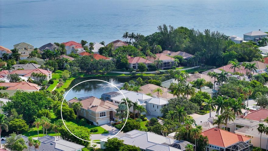 This 4 bedroom, 3 1/2 bath home is located behind the gates of Bay Isles in maintenance free, single-family home in desirable Queens Harbour.  From the minute you enter this expansive main entry,  you feel the open, bright  and airy floor plan with soaring ceilings. Perfect for entertaining, the kitchen features two islands, large wine cooler, gas stove with a downdraft for venting, wet bar and a microwave convection oven.  The home has been remodeled to include:  Hurricane front entry doors, hurricane sliding glass doors and windows, hurricane garage door, new roof installed in 2022 with gutters, pool re-surfacted and tiled, front and rear pavers, custom window treatments, custom fitted closets, LED lighting throughout.  Leave your worries behind - Queens Harbour maintains the exterior landscaping and exterior painting on a five year rotating cycle.   Directly adjacent to this home is a non-buildable park-like space,  with one neighbor only to the other side.    Bay Isles offers Deeded Beach Access, beach club with restrooms, showers, picnic tables and private parking.  Longboat Key Golf and Tennis Country Club is available for membership.  R&R is the pace, LBK is the place!!!