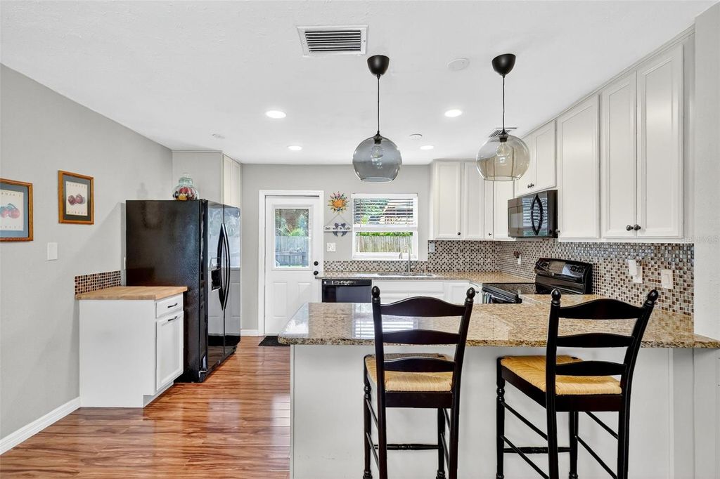 Photo of 4436 W Wisconsin Avenue, Tampa, FL 33616 (MLS # TB8435703)