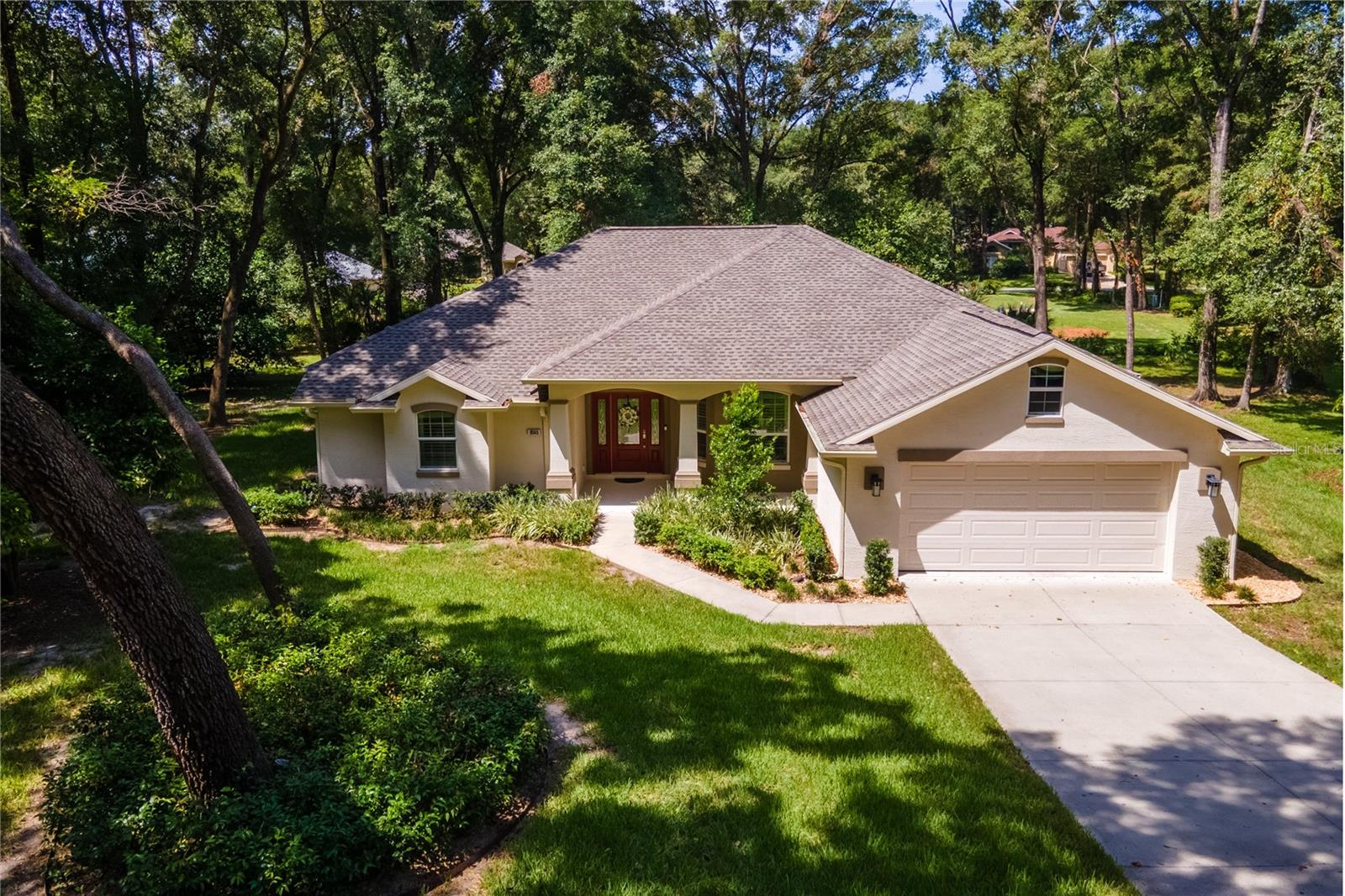 Discover your dream home at 9540 SW 189th Court in the serene community of Dunnellon, Florida. This stunning newer construction home boasts a spacious 3-bedroom, 2-bathroom layout with 2,073 square feet of luxurious living space and over 3,000 square feet total under roof. Enjoy the benefits of a split floor plan that includes high coffered ceilings, an open-concept design, a formal dining room, casual dining room with a beautiful open view of the backyard, granite countertops throughout and modern upgrades that won't be overlooked!
The expansive living area seamlessly extends to a large screened-in back porch, complete with tall sliding doors that forge a connection to the outdoors. Dine formally or casually while taking in picturesque views of the surrounding wildlife, including deer, fawns, and turkeys.
Located in a peaceful cul-de-sac in Rainbow Springs Country Club, residents enjoy beautifully mature landscaping and access to a community clubhouse featuring a delightful restaurant, a swimming pool, and a range of recreational activities. Play shuffleboard, tennis, or billiards, or relax on the 9-hole frisbee golf course. Engage in fitness routines, pickleball, horseshoes, bocce ball, and numerous walking trails.
Conveniently close to the World Equestrian Center and essential shopping, this property offers a perfect blend of privacy and accessibility. Outdoor enthusiasts will appreciate the proximity to KP Hole Park, Blue Run of Dunnellon Park, Withlacoochee State Forest, and the Cross Florida Greenway, where you can canoe, kayak, snorkel, tube, camp, and more.
Experience a vibrant lifestyle surrounded by nature and community at this exceptional property.