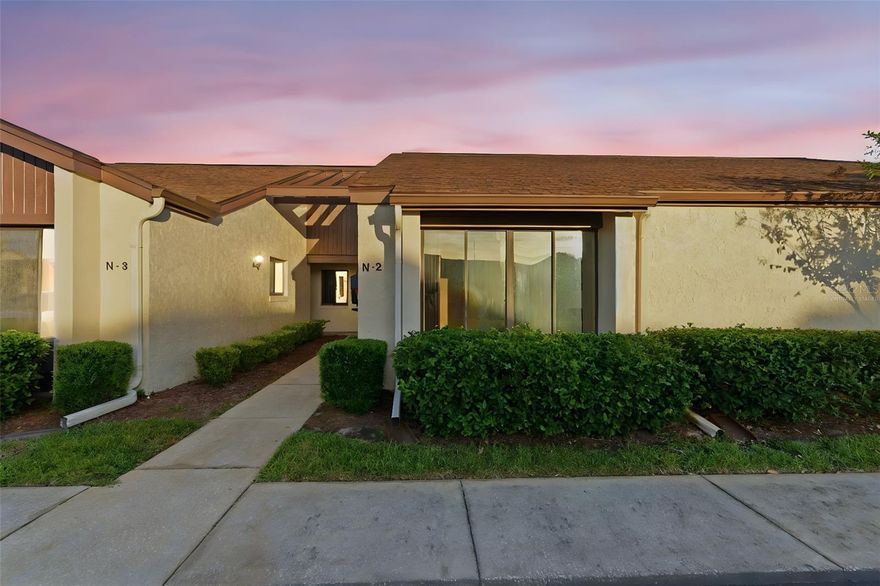 One or more photo(s) has been virtually staged. Discover easy, low-maintenance living in this refreshed 2-bedroom, 2-bath condo tucked inside the sought-after 55+ community of Breezewood Village in Orange City. Recent updates include fresh interior paint, a newly retiled walk-in shower in the primary suite, and brand-new LVP flooring in the rear porch—an inviting bonus space overlooking a private backyard with no rear neighbors.

The single-story layout offers effortless accessibility with no stairs, a spacious living/dining combo, spacious bedrooms, and a generously sized in-unit laundry room. The kitchen features plenty of cabinetry and overlooks the porch and back yard, while both bedrooms include full-size closets and natural light.

Step outside and enjoy the perks of a well-kept community—pool, clubhouse, and shuffleboard courts just across the street, plus regular social gatherings that make Breezewood Village feel like home, not just housing. The HOA covers exterior maintenance, roof, lawn care, building insurance, pest control, water, sewer, and trash, giving you true lock-and-leave convenience. One assigned parking space and guest parking are included.

Prime Central Florida location: less than 2 miles to AdventHealth Hospital, minutes to Publix, Target, restaurants, banking, and local shopping, with quick access to I-4, SunRail, DeLand’s Historic District, and Blue Spring State Park. Love the coast? You're only ~35 minutes to New Smyrna Beach and Daytona Beach. Golfers will appreciate easy access to Glen Abbey, DeBary G&CC, Victoria Hills or Deltona Club Golf Course, a top-rated public courses just minutes away.

Whether you're seeking year-round living or a Florida seasonal retreat, this move-in-ready condo offers comfort, convenience, and community in one of Orange City’s most established 55+ enclaves.