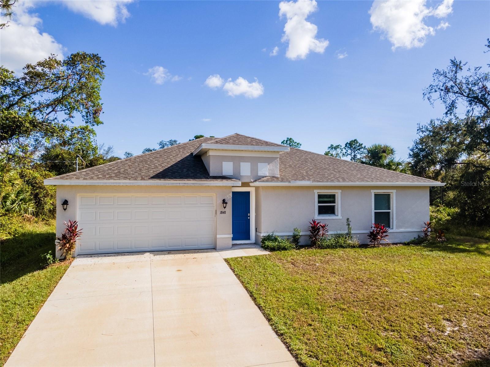 Welcome to your dream home! This stunning LIKE new home, only 1 year old single-family residence features 3 spacious bedrooms and 2 beautifully designed bathrooms, offering the perfect blend of comfort & style. As you step inside, you'll be greeted by an abundance of natural light streaming through large windows, highlighting the elegant luxury vinyl flooring throughout the main living areas. The heart of the home boasts a modern kitchen, complete with sleek shaker cabinets, stainless steel appliances, and a generous island that's perfect for entertaining. Relax in the expansive master suite, which includes a private ensuite bathroom and a walk-in closet. The additional 2 bedrooms are equally spacious, each featuring generous closets for all your needs. The second bathroom is designed with a single vanity and a convenient shower/tub combo. Step outside to enjoy the large backyard and walkout lanai, perfect for outdoor gatherings or quiet evenings under the stars. Schedule your showing today!