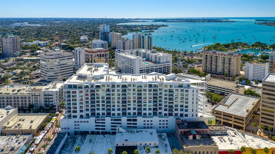 Exquisite, elegant, and serene living in the heart of splendid downtown Sarasota! Enjoy the morning on your balcony with your coffee in hand as you enjoy the bird’s eye views, and evenings relishing the Gulf breezes. This gorgeous condo is impeccable with European cabinetry, quartz countertops, custom woodworking, porcelain tiles, refreshing, subtle color palette, California Closets, and more! The open, expansive floor plan boasts natural light galore inspiring a cheery, light-hearted ambiance. The split bedroom layout allows for privacy and generous breathing space when entertaining guests. The primary bedroom is spacious and delightfully opens to the balcony for fresh air, complete with a thoughtfully designed walk-in closet, and a pristine en suite bathroom with dual vanities. The airy guest bedroom and en suite are perfect for hosting family and friends. There is a den for work or hobbies, and a powder room for guests. Spend afternoons by the glorious 65-foot infinity pool with peek-a-boo views of the Gulf! Enjoy all of the splendid, convenient amenities that The Mark offers to compliment your lifestyle: fire pit lounge, cabanas, outdoor grills, fitness center, spin room, clubroom with catering kitchen, pool table, café-style office space, 24-hour staffed reception, pet-friendly, security, an assigned parking space, and a separate secured storage unit. Saunter around downtown Sarasota, shop at the Saturday Farmers' Market, savor the authentic lemon tarts at C’est La Vie, attend the Sarasota Ballet or Orchestra, the lush gardens of Selby, and dozens of delightful restaurants and cafes! Enjoy sunny beach days at Lido Key and powdered sugar-soft beach walks. Evening strolls at the marina only a few blocks away, boutique shopping and street musicians at St. Armand’s Circle, or pop out for a last-minute cocktail at sunset with friends. The Mark is the epitome of downtown easy, breezy, luxury living! Swoop now before this gem is gone!