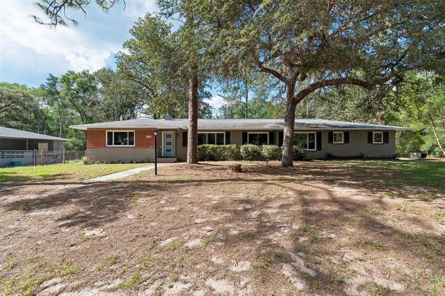 Beautifully updated 3-bedroom, 2-bath home featuring updated electrical, complete re-plumbing, new windows, and a newer roof for peace of mind. The renovated kitchen offers modern style and functionality, while the stunning wood floors add warmth and character throughout. Enjoy a spacious family room perfect for entertaining or relaxing, highlighted by iconic University of Florida wallpaper that adds a unique local touch. This move-in-ready home combines classic charm with major modern upgrades. Schedule your private showing today!