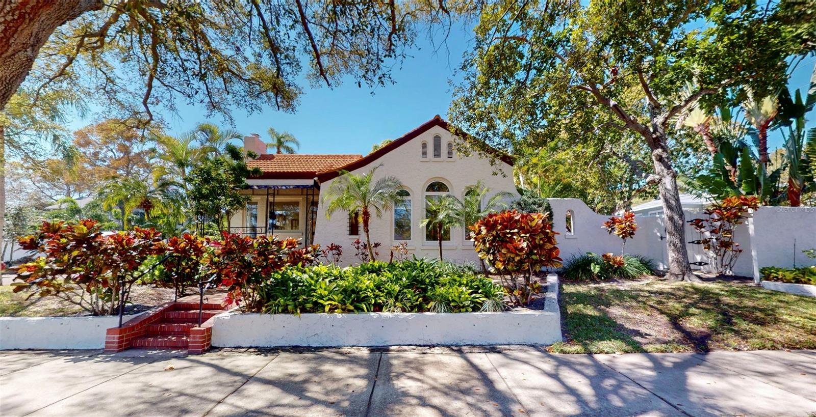 Beautiful & historic 1923 Old-Northeast home with beautiful fireplace, volume ceilings, original wood floors and fixtures, and tons of charm. Attached to the 4-bed/4-bath home are 3 one-bedroom apartments with their own courtyard and parking area. There are two totally different yard-areas for the apartments vs the house. The property encompasses almost 3 full lots. Property encompasses 4 addresses: 101, 103, 105 & 107 21st Ave North. Large treed courtyards with nice garden areas and a fenced in back yard for the home. Lots of off-street parking in the back. This could be a family compound or a property with income. Loads of possibilities. Must see. Please do not disturb or talk to the tenants.
