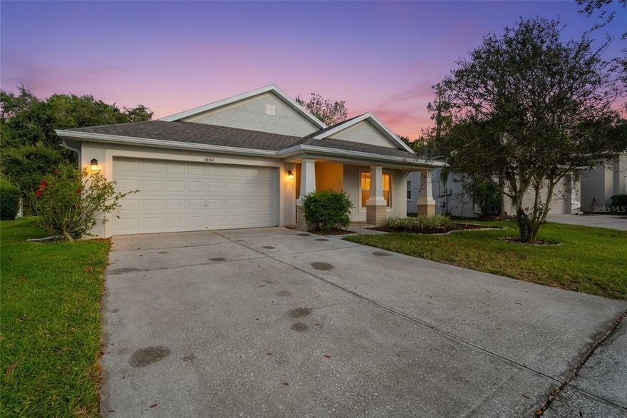One or more photo(s) has been virtually staged. Looking for a place where you can grow, belong and build a life for you and your family?
This four-bedroom, two-bath home in Wesley Chapel’s sought-after Oak Creek community offers the perfect blend of space, comfort, and peace of mind, all at an excellent value under $400,000. With ample living space, it’s designed for the way families live today: open, flexible, and filled with potential.
Step inside to find a welcoming layout featuring an eat-in kitchen and a choice of two versatile dining spaces. Ideal for family meals or gatherings with friends. The home’s high ceilings add a sense of openness, while tile floors in the kitchen, baths, and foyer balance durability and function. The living areas are ready for your personal touch, offering the perfect opportunity to make this home truly your own.
The big work has already been done for you. A brand-new roof, new HVAC system, and fresh exterior paint were all completed within the past few months, and each comes with transferable warranties for long-term peace of mind. That means you can focus on what matters most: creating the home you’ve dreamed of.
Out back, enjoy your morning coffee or weekend barbecues on your covered lanai overlooking a tranquil wooded conservation area.  It is a private retreat right outside your door. With a fenced yard, interior laundry room, and two-car garage, this home delivers the convenience and functionality families need.
Oak Creek is one of the area’s most enjoyable and respected communities, known for its beautiful pool, tree-lined sidewalks, and low HOA at just $110 yearly. Its location gives you easy access to shopping, dining, and top-rated schools with a Wesley Chapel address that adds long-term value.
Four bedrooms. Two baths. A great layout. Big updates already done. Whether you’re starting your story or building the next chapter for your family, this is a home where pride and possibility meet. Schedule your showing today — and see why this Oak Creek home could be the one you’ve been waiting for.