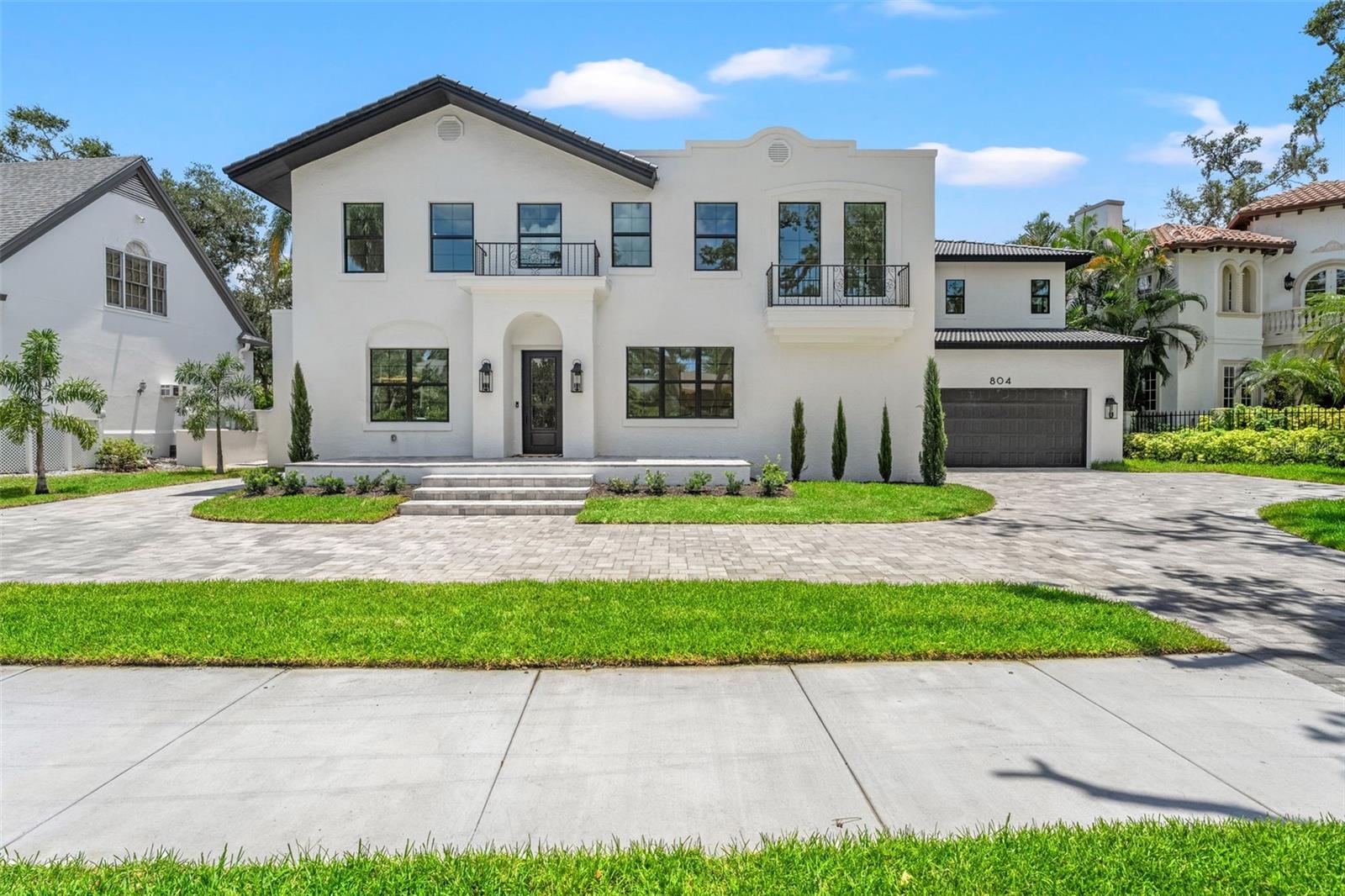 Step into a piece of Tampa history with this stunning original Beach Park Mediterranean estate, impeccably restored between 2023 and 2025 to fuse timeless charm with contemporary sophistication. This grand residence spans an expansive 6,398 square feet and boasts 7 spacious bedrooms, 9 exquisitely designed bathrooms, and a wealth of living spaces crafted for both daily comfort and lavish entertaining. The interior captivates with wide-plank white oak flooring flowing seamlessly throughout, complemented by custom white oak cabinetry and paneled appliances in the gourmet kitchen, where a hidden pantry adds a touch of sleek functionality. Entertain in style with two elegant dining rooms, a cozy den with its own wood burning fireplace, and a sprawling living room awash in natural light with a gas burning fireplace. For the wine enthusiast, a custom wine closet provides the perfect haven to store and showcase your collection. The first-floor primary suite offers a serene retreat with its own luxurious en-suite bath, find yourself greeted from head to toe by honed iceberg marble. While the second floor boasts an additional primary/guest suite, equally impressive with ample space for visitors or multi-generational living. Every one of the 7 bedrooms enjoys the luxury of a private en-suite bathroom, ensuring comfort and privacy for all. Organization meets opulence with California Closet systems installed in the bedroom closets, offering tailored storage solutions that maximize space and luxury. Convenience shines with laundry rooms thoughtfully placed on both floors of the home. Outside, a 2-car garage and single-car covered porte-cochère meet the circular roman paver driveway, adding practicality and a touch of grandeur. Located in one of the most established and coveted streets in Beach Park, don't miss your chance to live in this amazing neighborhood where you can walk the tree-lined streets and take in the pleasant waterfront views. This home is just moments from Tampa’s premier dining, shopping, and cultural destinations- also zoned for South Tampa's A-Rated school districts. A rare chance to live in a fully restored historic masterpiece with every modern indulgence—schedule your private tour today!