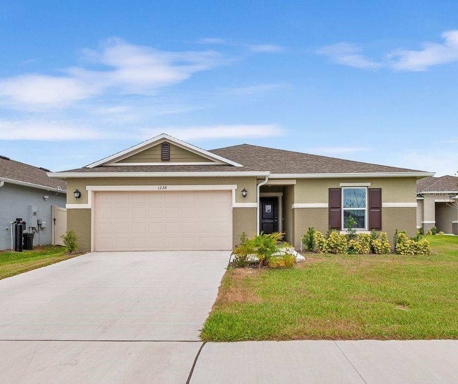 Better Than New 4 Bedroom Home, Handicap Accessible, No CDD, & Move-In Ready! This 4 bedroom, 2 bath home is truly better than new and designed with comfort and accessibility in mind. With 36” doorways, an automatic door opener, and a roll-in shower, it’s thoughtfully built to be handicap accessible while maintaining a modern and stylish feel. Inside, you’ll find ceramic tile throughout, creating a sleek, low-maintenance flow from room to room. The kitchen is a chef’s delight with stainless steel appliances, granite countertops, and plenty of space to gather and cook. Step outside to enjoy your huge backyard, fully enclosed with a vinyl privacy fence that's perfect for pets, play, or gardening. The large lanai provides the ideal spot for relaxing or entertaining year round. With no CDD fees and thoughtful upgrades throughout, this home is ready for its next owner to move right in and enjoy!