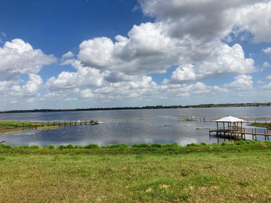 Build Your Lakefront Legacy at 216 Caladium Ave — Water Ridge. Imagine waking up to panoramic, picture-perfect views of Lake Alfred—with its only private cove just beyond your future backyard. This rare ±0.33-acre lakefront homesite in Water Ridge offers an exceptional opportunity to build a custom residence where every day feels like a vacation. With lakefront homes nearby commanding $1M+, this location is truly one of Central Florida’s most coveted addresses. Nestled within the resort-style, gated community of Water Ridge, this homesite delivers more than just a view—it delivers a lifestyle. Water Ridge is celebrated for its private lake access, three shimmering lakes, and premium community amenities designed for both relaxation and active living: a beautifully appointed clubhouse, 24-hour fitness center with saunas, three pools (including lap and resort style), tennis, pickleball, and basketball courts, scenic walking trails, multiple boat docks, and boat trailer storage—all maintained with meticulous care. Here, you can launch a kayak at sunrise, stroll the landscaped pathways with neighbors, or tee up a game of pickleball—all without ever leaving the neighborhood. The secure, gated setting provides peace of mind while remaining convenient to major highways including I-4, putting Tampa, Orlando, theme parks, airports, and employment centers within easy reach. Local Dining & Shopping: Lake Alfred and nearby Winter Haven/Auburndale offer a charming complement to lakeside living with delicious local eateries and casual neighborhood favorites: Back Porch Restaurant – beloved local spot with a cozy atmosphere and classic favorites: Lavender ’N Lace Tea Room & Restaurant – a crowd-pleasing pick for brunch and lunch: Calogero’s Pizzeria and Las Comadres Taqueria Y Mariscos add variety for everyday dining. For upscale dining and diverse culinary experiences, Winter Haven’s vibrant restaurant scene is just a short drive away. Whether your buyer dreams of custom lakefront living, a builder’s canvas for a luxury retreat, or a legacy estate for generations, 216 Caladium Ave provides an exceptional foundation in one of the area’s most elite communities. Let’s make the dream of lakefront living a reality. Video Available.