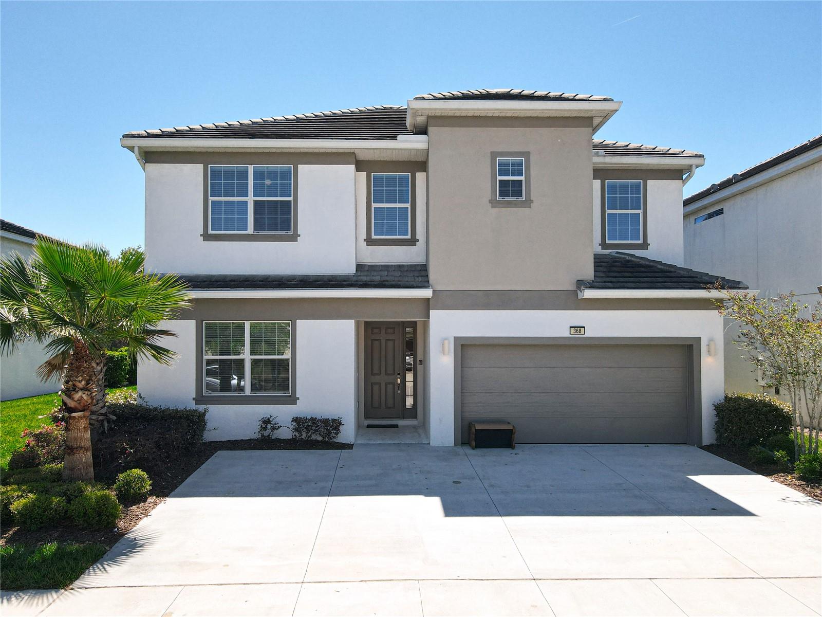 Discover the ultimate vacation home and investment in Bellavida Resort, a 24-hour guard-gated community. This two-story pool home offers 12 bedrooms and 12.5 baths, designed for entertaining large groups and multi-family living. An expansive, open-concept layout features high ceilings, recessed lighting, and nearly floor-to-ceiling sliding doors that flood the space with natural light and unveil views of the sparkling pool.
The chef-focused kitchen is the heart of the home: stainless steel appliances including two refrigerators, two dishwashers, and two microwaves, abundant custom cabinetry, stone countertops, and a generous center island with modern pendant lighting. The kitchen flows into the family room, which overlooks a large covered lanai, provides direct access to a half bath, and opens to a spillover spa—your private Florida retreat.
Downstairs, the luxurious master suite offers a tranquil sanctuary with an en-suite bath featuring a dual-sink vanity, an oversized mirror, a walk-in closet, and a separate water closet.
Upstairs, unwind in a spacious loft with a pool table and wet bar, followed by a Disney®-themed movie theater with stadium seating for nine. The home includes eight bedrooms on the upper level, including a double master and seven additional rooms, two of which are custom-designed Toy Story® and Princess® themed.
Entertainment continues in the Avengers® and DC®-themed converted garage, fully equipped with foosball, air hockey, arcade games, a gaming console, and more for hours of indoor fun.
Bellavida Resort amenities abound: a modern clubhouse, playground, two resort-style pools, basketball and volleyball courts, a game room, a cafe, and more. Conveniently located near award-winning restaurants, shopping, theme parks, and major highways for easy access to both coasts—an ideal setting for resort-style living or strong rental income.
Schedule your private viewing today.