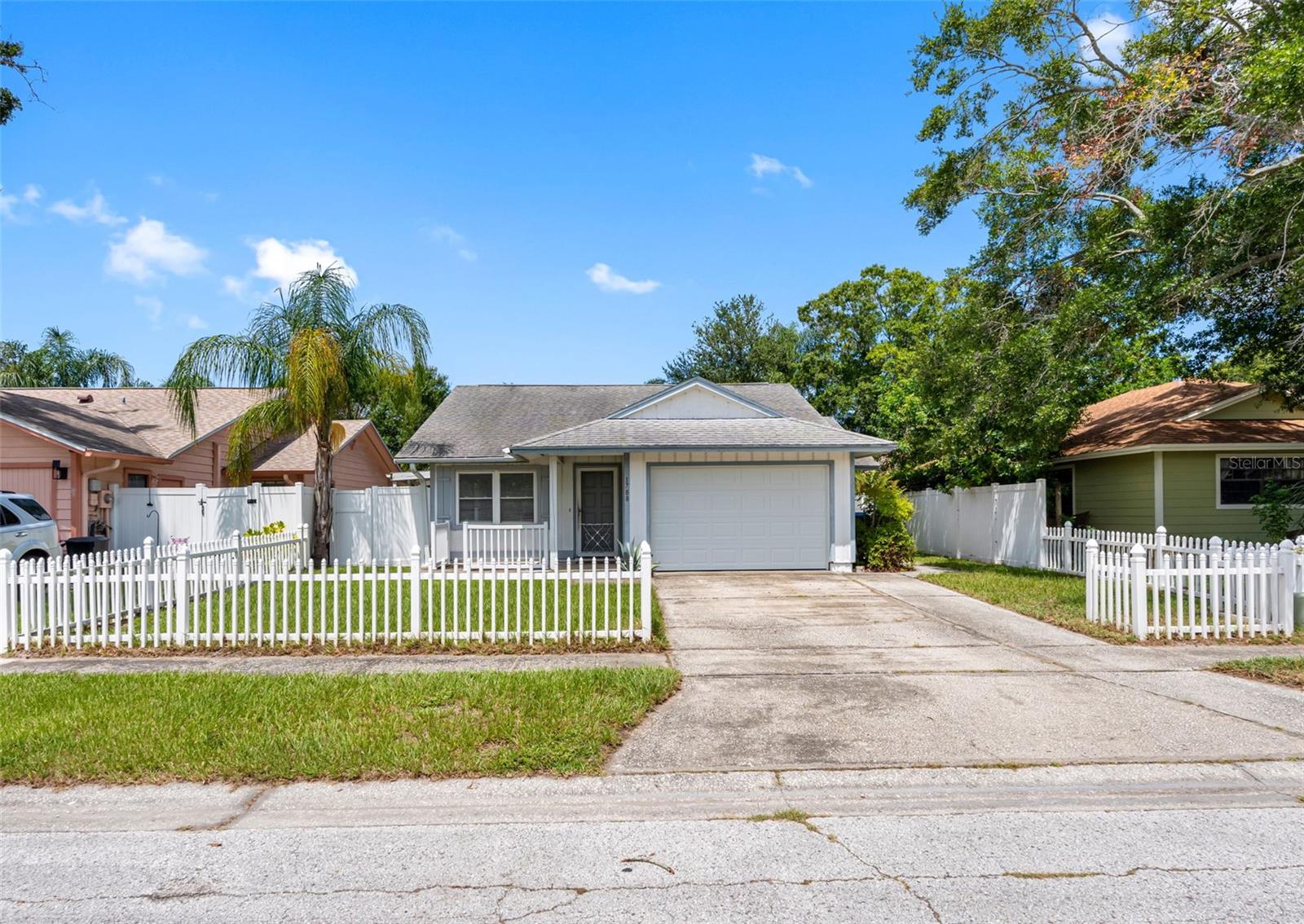 Affordable Central Pinellas Home with Bonus Room & Spacious Yard! Why rent when you can own this affordable 2-bedroom/2-bath home with a bonus room used as a 3rd bedroom (not included in the square footage)! Conveniently located in the heart of Pinellas County, this home offers easy access to shopping, dining, beaches, and major roadways.Inside, you'll find vaulted ceilings, new vinyl laminate flooring, and ceiling fans throughout, creating a light and comfortable living space. The master bedroom has an en-suite bathroom with new dual sink vanity, and walk in closet. The bonus room includes a stackable washer and dryer, adding practicality and extra flexibility. Enjoy Florida living outdoors with multiple patios—front, side, and rear—perfect for entertaining or relaxing. The large fenced yard with no rear neighbors is ideal for pets, gardening, or simply enjoying some privacy. Additional highlights include a brand-new garage door and low-maintenance exterior.This is a great opportunity for first-time buyers, downsizers, snowbirds or investors.