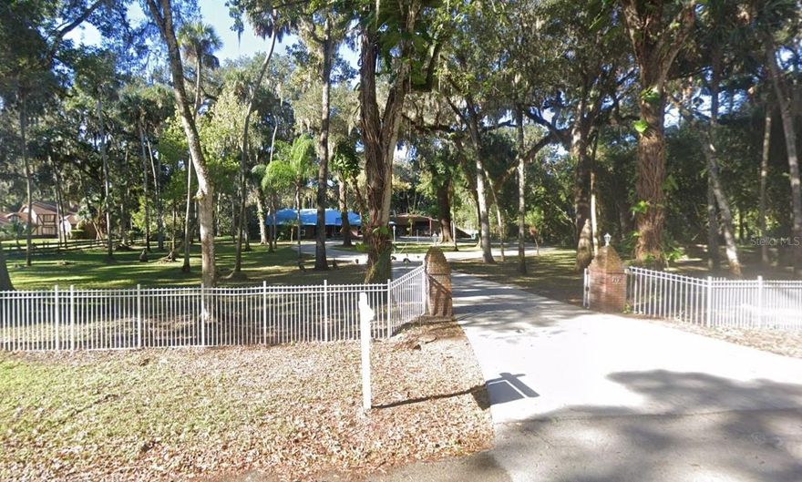 Hard-to-find, fully loaded estate property offering space, privacy, versatility, and tranquility just minutes from the beach. Set on a massive 1.86-acre tree-shaded lot, this exceptionally maintained home delivers the perfect blend of country serenity and coastal convenience. Whether you’re looking for a primary residence, multigenerational setup, or a lifestyle property with room for all your toys, this one truly has it all. So what makes this place so special? 1) Expansive 3 bed / 2 bath main home with generous living spaces and thoughtful upgrades throughout. 2) Separate studio apartment located at the rear of the property, complete with bedroom space, full bath, closets, its own A/C system, and brand new carpet, ideal for guests, in-laws, or a private office. 3) New Heavy-duty 50-year metal roof installed in 2008 on the main home. 4) New shingle roofs (2024) on both front and rear storage buildings. 5) Whole-house generator providing peace of mind and uninterrupted power. 6) Resort-style screened-in pool and 56' X 40' massive pool deck, perfect for entertaining or relaxing in total privacy. 7) New 3 HP pool pump installed November 2025, plus a newly installed deep well water tank system that draws from the aquifer and waters the yard without relying on city water. 7) Well-appointed eat-in kitchen featuring granite countertops, soft-close cabinetry, induction cooktop, wall oven, water purification system, and abundant storage. 8) Spacious primary suite with sliding doors to the pool deck, bay window overlooking the pool, dual closets, and an updated en-suite bathroom with a walk-in shower. 9) Two Large guest bedrooms sharing a hall bath with direct pool access. 10) All-new floating laminate flooring installed throughout the main home, and interior fully freshly painted. 11) Interior laundry room with newer washer/dryer, double closet, and an additional stainless refrigerator included. 12) Oversized attached 2-car garage with epoxy flooring. 13) Massive RV barn with 220V electrical outlet, plus two additional large outbuildings offering extensive storage for equipment, vehicles, and hobbies. 14) Beautiful mature oak trees throughout the property providing shade and privacy without compromising the home. 15) Unbeatable location, just a 12-minute drive to the beach, minutes from Intracoastal waterways, historic downtowns, arts districts, parks, shopping, dining, and quick access to I-95. Properties offering this level of land, infrastructure, and flexibility are exceptionally rare. Don’t miss the opportunity to own a true Florida estate that delivers on space, function, and lifestyle, ready for immediate enjoyment and long-term legacy living. Easy to show. No HOA/CDD. Feel free to soft pitch before writing anything up. Disclosures and MLS info sheet available. No assignable contracts accepted.