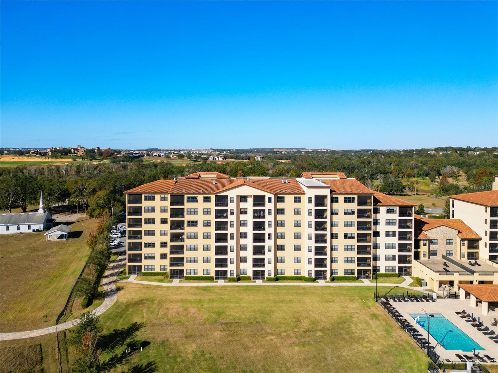 End Unit | No Upstairs Neighbors | Prime Lakeside Living in Montverde, FL
Experience the ultimate in lakeside elegance with this exceptional top-floor end-unit condo in the charming community of Montverde. Boasting three bedrooms and three bathrooms, this meticulously maintained, move-in ready residence offers privacy, natural light, and stunning water views—your perfect retreat just 1.2 miles from the renowned Montverde Academy.
Enjoy unparalleled convenience with quick access to the Florida Turnpike, 429, and 408 highways, as well as the vibrant shops and dining options of downtown Winter Garden. Wake up each morning to breathtaking sunrises over Lake Siena and unwind on your tranquil screened lakefront patio—an ideal setting for relaxation and entertaining.
Inside, the spacious open floor plan features a modern kitchen with a generous island that seamlessly connects to the great room and dining area, creating an inviting space for gatherings with family and friends. The end-unit location enhances privacy and floods the home with natural light, amplifying its airy, welcoming atmosphere.
Resort-style amenities elevate your living experience, including a heated lakefront pool, cozy fire pit, BBQ area, and shaded seating—perfect for socializing or unwinding. Stay active in the state-of-the-art 24-hour fitness center or host professional meetings in the dedicated conference room.
Take advantage of scenic lakeside walking paths or explore the nearby West Orange Trail, offering over 20 miles of biking, walking, and running opportunities. Security is a priority with gated access and security services, providing peace of mind. Each owner is assigned two parking spots, with ample guest parking available.
As a resident, you gain exclusive access to the Spa at the Club at Bella Collina, along with fine dining options and a vibrant calendar of social and culinary events. The HOA simplifies your lifestyle by including internet, cable, and water services.
This isn’t just a home—it’s a lifestyle of comfort, convenience, and lakeside luxury waiting for you to embrace. Don’t miss this incredible opportunity—schedule your private tour today and start envisioning your new lakeside retreat!