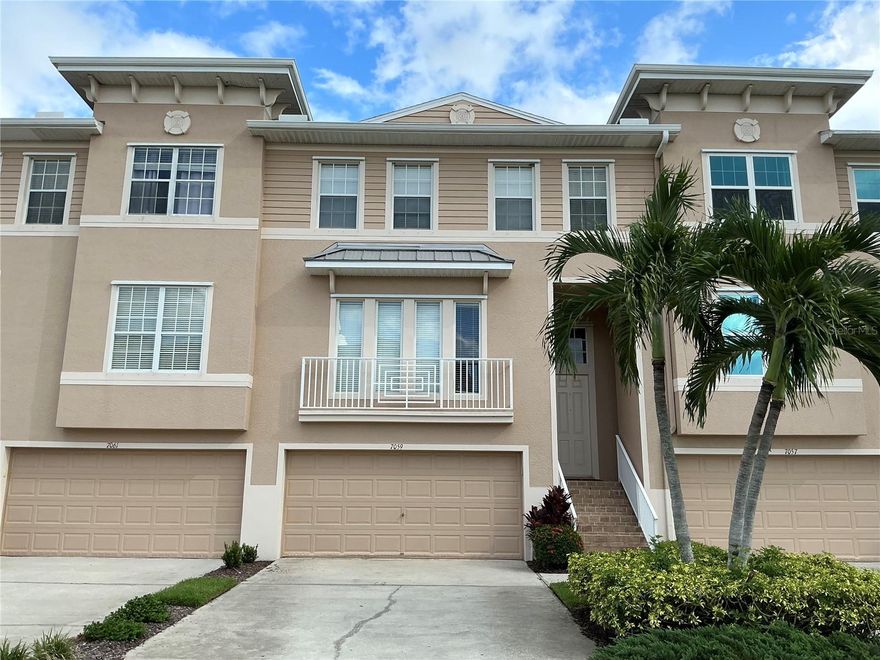 Luxury style townhome located in the gated community of Seminole Isle. This unit offers 3 bedrooms / 2.5 bath and numerous updates. The oversized gourmet kitchen features upgraded maple cabinets, stainless steel appliances and granite counter tops with an island, breakfast bar and computer/work station. Thisopen Floor plan boasts stunning hardwood flooring throughout. The upstairs loft can be used as an office or child play area. All bedrooms are upstairs with carpet.  The master bedroom suite is oversized with room for a. private office as well as large dressers and easily a King size bed. The master bath has double sinks, jetted spa tub with separate shower and a large walk in closet. Relax on your screened and spacious balcony taking in the serene tropical views or down below on the open lanai. The oversized garage can hold two or more vehicles with lots of extra storage. This unit sits on a quiet and more private lot in the community that offers serene and natural views. This resort style community offers a top notch clubhouse, heated pool, tennis courts, fitness center, boat dock access for kayaks or canoes, picnic areas and a walking trail. Walk across the street to the lovely lake Seminole park which offers additional recreational trails and lake boating access. Only a 10 minute drive to the pristine gulf beaches.