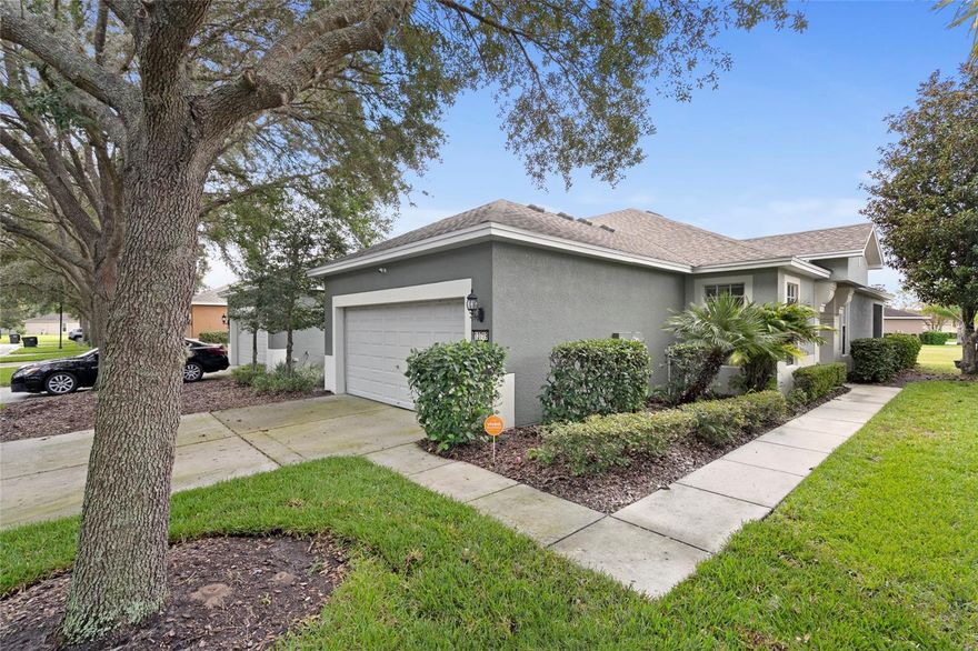 Looking for a low maintenance Florida home in a lakeside community then this is the one for you.  The first thing you will notice as you walk up to this home is the lovely mature landscaping and the brand new roof so no worries there.  Enter the home through the large door and immediately feel the open living feel with the living room, dining room and kitchen featuring nice wooden cabinets and bar area.  Need some privacy for your office or maybe a craft room, then enter the double french doors to find a nice sized den/office space.  The home is bright and airy with lots of light and the double sliders lead to a large screened in porch overlooking a quiet grassy space.  The master bedroom is very big and features a walk in closet and an ensuite bathroom  with a shower and double vanity.  The second bedroom is also large and has enough room comfortably for a king or two double/queen sized beds.  The second bathroom has a tub shower and a single vanity.  The indoor laundry room makes for convenience and storage.  

The fees cover roof replacement, exterior painting, lawn maintenance and irrigation and trash.   The amenities are beautiful and include  a large pool and a clubhouse where you can attend activities such as Bingo, Bunko, Music Bingo, Pilates, and family and adult events.if you like sports, then join in with the fitness related classes, or play tennis or pickleball or play some basketball on the half court.  Like fishing, then utilize the fishing dock . Maybe bring the family to the playground.  Never a dull moment for the whole family.  Do not miss out on this beautiful home.