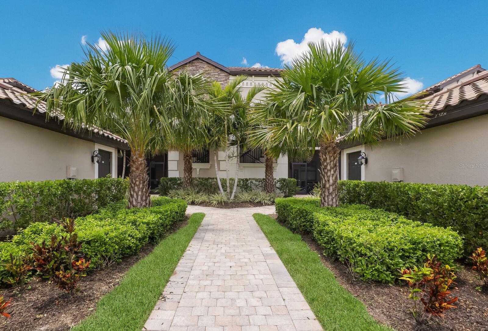 Welcome to Your Fully Furnished Florida Getaway! Pack your bags and settle into this beautifully decorated 2-bedroom, 2-bath condo with a versatile den — perfect as a third bedroom or a cozy retreat. With soaring ceilings and sweeping views, this home offers a bright, open layout designed for comfort and style. The spacious master suite features a king-size bed, dual walk-in closets, and a spa-inspired bathroom complete with dual vanities and a large walk-in tile shower. The guest bedroom offers a queen bed, nightstand, dresser, and ample closet space. Need extra room? The den includes a daybed with trundle — ideal for visitors or a quiet reading nook. Entertain with ease in the open-concept living area, or sip your morning coffee on one of the two screened lanais — front and back — while soaking in views of the Arnold Palmer-designed Commander Course (hole #1, to be exact!). The kitchen is a dream for home chefs, featuring stainless steel appliances, a breakfast bar, and plenty of natural light. Extras include an in-unit washer and dryer, a detached one-car garage with storage, and all the essentials for fun in the Florida sun: his and her bikes, beach chairs, tennis and pickleball racquets, and more. Located in the sought-after Lakewood National Golf Club, you’ll enjoy access to world-class amenities: Two 18-hole championship golf courses, Resort-style pool with tiki bar, Full-service spa, Tennis, pickleball & bocce courts and State-of-the-art fitness center. Membership transfers for just $642 — all you pay is the cart fee! Monthly rentals under 6 months include utilities and are subject to 13% sales and resort tax. Stays over 6 months require first and last month’s rent, security deposit, and application fee. Don’t wait — this vacation rental won’t last long! Life is what you live. Style is how you live it.