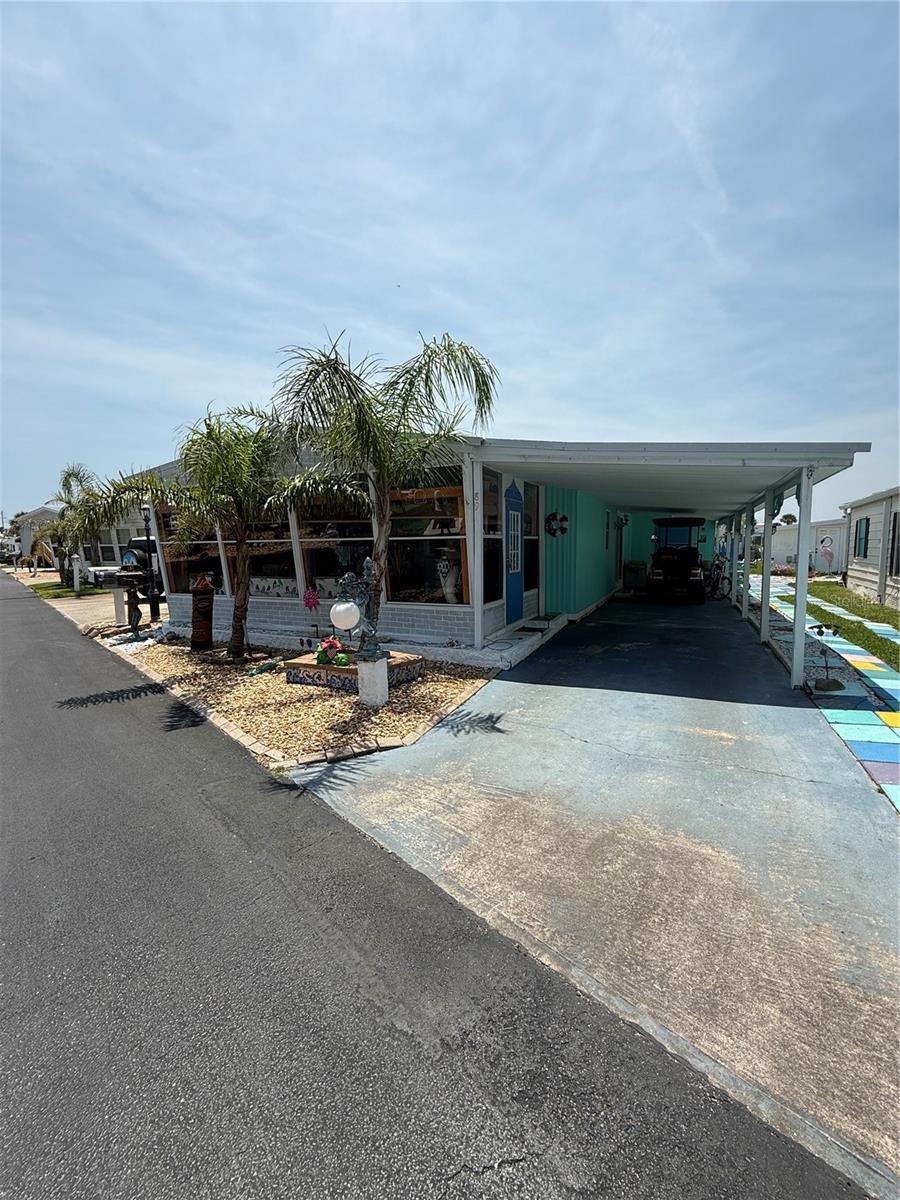 An artist retreat on the beachside! This two bedroom, two bath free-spirited home is the artist's canvas! The interior is painted in fabulous colors with murals and touches limited only by the imagination. The living area is open to the enclosed porch, allowing for a nice flow. This is truly a home you would need to see to appreciate. Handcrafted shutters and intricate fence on the exterior reflect the owners' style. Painted flooring throughout for easy beach living! Enjoy you morning coffee in the Florida room before walking or riding over to the beach or to the Intracoastal to fish.
Surfside Estates is a resident owned co-op community, located along the Intracoastal Waterway, just across the street from the beach and where you own your lot-share and never pay rent. The community has a low maintenance fee of $180 each month that includes cable TV, high-speed internet, lawn service, heated saltwater pool, two fishing piers and clubhouse. The clubhouse has a kitchen, pool tables, TV, library, fitness center and shuffleboard. Along the Intracoastal, you will find a screened gazebo, fire pit, barbecue, benches, horseshoe pits, the two partially covered fishing piers, kayak racks and launch. With an active Social Club, you can choose from yoga, pool aerobics, an ice cream social, Bingo, pool teams, card tournaments, karaoke, dances, community breakfasts, potluck dinners, and so much more! Or take a walk, ride your bicycle, drive your golf cart around the friendly neighborhood. Either way, there seems to be something for everyone.