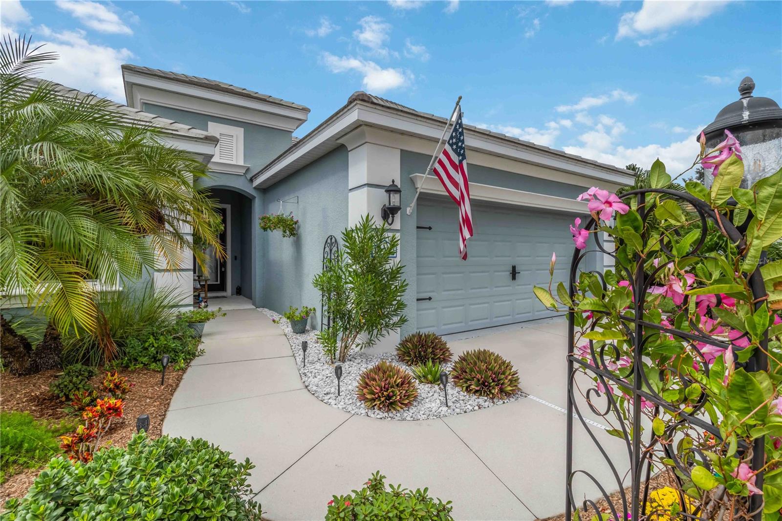 AMAZING POOL & SPA! Your own Tropical Escape awaits within Grand Palm, one of Venice’s award-winning gated communities! Built in 2017, this 3-bedroom + den/office, 2-bathroom home has been freshly painted throughout the interior and features all new light fixtures—ready for you to move right in and enjoy. Step outside to your private oasis: a heated (gas), saltwater pool (26x12) and oversized spa (7x7), surrounded by NEW, lush tropical landscaping on a private conservation lot—no rear neighbors, just nature and tranquility. The spacious paver lanai offers plenty of room for lounging, dining, and TV watching, while a StormSmart remote-controlled hurricane shutter makes closing off the patio simple and secure. New remote-controlled lighting adds evening ambiance. Inside upgrades include: Custom glass insert in front door, New landscaping and fireplace wall feature, New closet systems in both primary bedroom closets, Brand new stainless refrigerator, Rain shower faucets in the primary bath, Shaker wood trim on all windows. The kitchen is a chef’s dream with quartz countertops, tile backsplash, gas oven/range, Bosch dishwasher, wine fridge, New SS GE fridge, wood cabinetry with undermount lighting, and a pantry. The adjoining dining area showcases a tray ceiling with new lighting. The den/office with French doors is currently set up as a sports-viewing room—perfect for hobbies or work-from-home. A barn door adds privacy to the guest wing, which includes two spacious bedrooms and a full guest bath with tile tub/shower combo. The primary suite offers pool and nature views, tray ceiling, dual closets with custom systems (one walk-in), and a spa-inspired bath with dual sinks, tiled shower featuring rain and handheld fixtures, and plenty of natural light. Additional highlights: All new interior paint, All new light fixtures throughout, Remote-controlled lanai lighting, StormSmart lanai shutter. Located in Grand Palm, a resort-style, golf-cart-friendly community offering: 3 community pools, 2 spas, fitness center, and clubhouse, 26+ miles of walking and biking trails, Kayak launch and storage, Lookout Point Island on Adventure Lake, Pickleball, tennis, basketball, Bocce, sand volleyball, Playgrounds, picnic areas, Splash Pad, and weekly food trucks. Just minutes from Wellen Park, where you’ll find dining, shopping, a weekly farmer’s market, and CoolToday Park for Atlanta Braves spring training games. Historic Downtown Venice and Venice Beach are only 9 miles away! One of the few gated communities in unincorporated Sarasota County, offering significantly lower property taxes than nearby areas. Stay in and relax in your personal tropical haven—or head out to explore everything Venice has to offer. This home combines the best of modern upgrades, low-maintenance living, and resort-style amenities in one perfect package.