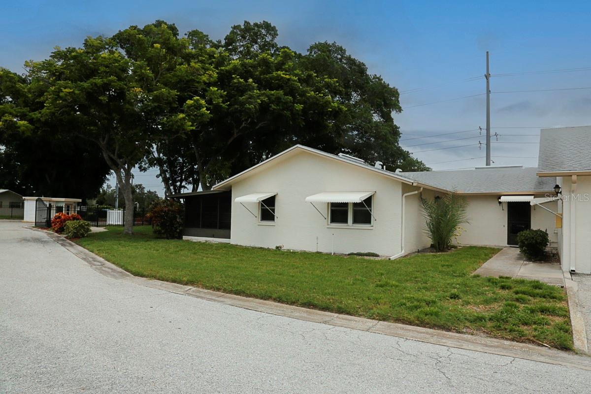 Nestled in beautiful South St. Pete you will find Westshore Village. A community that boasts walking trails, pickleball/tennis courts, a large pool and minutes from the gulf beaches! This well kept 2/2 condo is in a grouping of just 3 units in a NON-FLOOD Zone. Drive up through the gate to your own private garage with extra storage. This well kept home has an ample, L-shaped living dining combo, and is just off the kitchen. All appliances stay, there is a closet pantry & a small breakfast bar, that would work as a drop zone or computer space, whatever you need it to be. Primary bedroom is light and bright, has 2 closets, en suite bath & ceiling fan. 2nd bedroom just across the way has a generous sized walk in closet as well as a ceiling fan. Lots of storage in the hallway along with the washer/dryer has lots of space for towels and linens. Hall bath has a walk in shower, fully tiled for ease of use. Back patio has newer flooring and small a/c unit to keep you comfortable. A/C and water heater replaced in 2017. Roof was recently replaced. This quiet community has so much to offer, there is a small kayak launch for residents along with the skyway walking trail. This community is NOT age restricted and close to shopping, beaches, Skyway bridge, I-275, pretty much everything! Make an appointment today