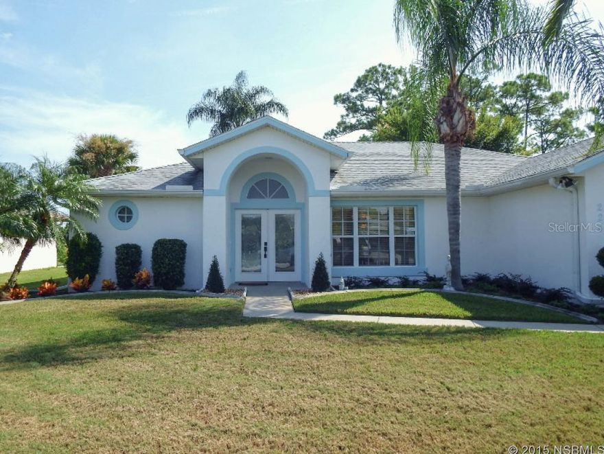Golfer's delight, situated on 70 foot golf-front lot overlooking Hidden Lakes fairways, and a short cart-ride away from New Smyrna Golf Course - two great courses to enjoy. Outstanding concrete block home with split-bedroom plan and awesome master suite that is accessed from French doors, with separate garden tub and shower and twin sinks. New, hard-surface counter tops in baths, new stainless appliances in kitchen, large, walk-in pantry, spacious breakfast nook overlooking golf course. Bright and airy golf-front family room offers panoramic views. Great golf views from every room but one guest room. 3rd bedroom features Murphy bed with built-in office for flexibility and every day use of your guest room. Electric screen for garage door. All-electric home, but natural gas is at the curb if you wish to bring it in. Architectural shingle roof 2010.   Large golf front patio out back, ready for entertainment.   Great central location, close to town & minutes to the beach, shopping and dining. Low HOA dues include Cable TV and sprinkler system.  Heated community pool available by optional membership. Great home in wonderful neighborhood. ;Water: City