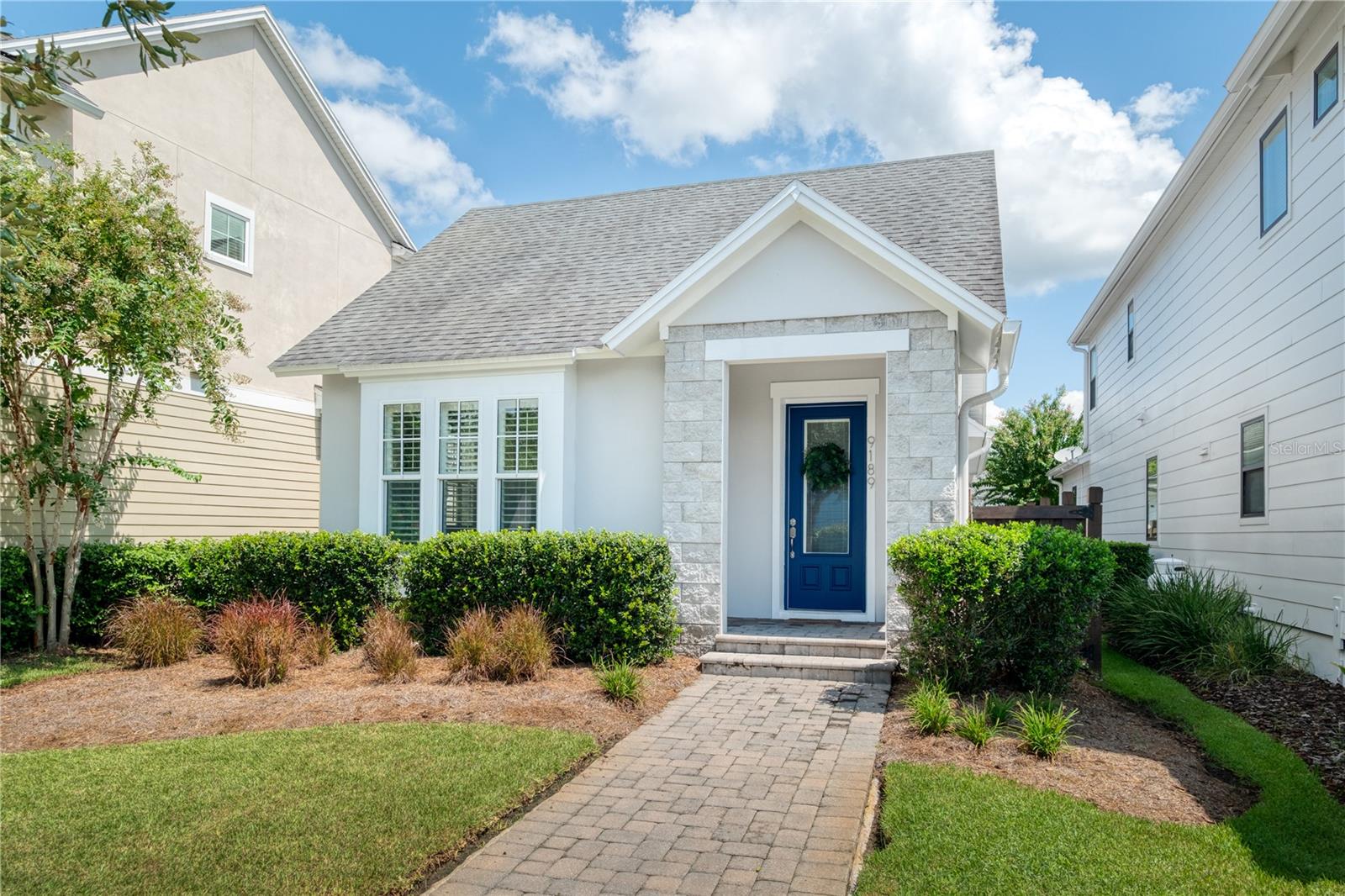 Welcome to 9189 Merrifield Street in the desirable Laureate Park community of Lake Nona! This beautifully maintained 3-bedroom, 2-bath home features an open-concept design with modern finishes, granite countertops, stainless steel appliances, and a spacious kitchen island perfect for entertaining. Enjoy durable tile flooring throughout, a versatile flex room ideal for a home office or guest space, and a private primary suite with dual vanities and a walk-in shower. The screened-in covered patio and low-maintenance fenced yard provide the perfect outdoor retreat. Additional highlights include a dedicated laundry room, a rear-entry two-car garage, and plenty of storage. Located just minutes from Orlando International Airport (MCO), Lake Nona Town Center, Medical City, Boxi Park, and top-rated schools, this home offers unmatched convenience and lifestyle. Laureate Park residents enjoy resort-style pools, fitness centers, walking trails, playgrounds, and high-speed fiber internet. This home is truly move-in ready!