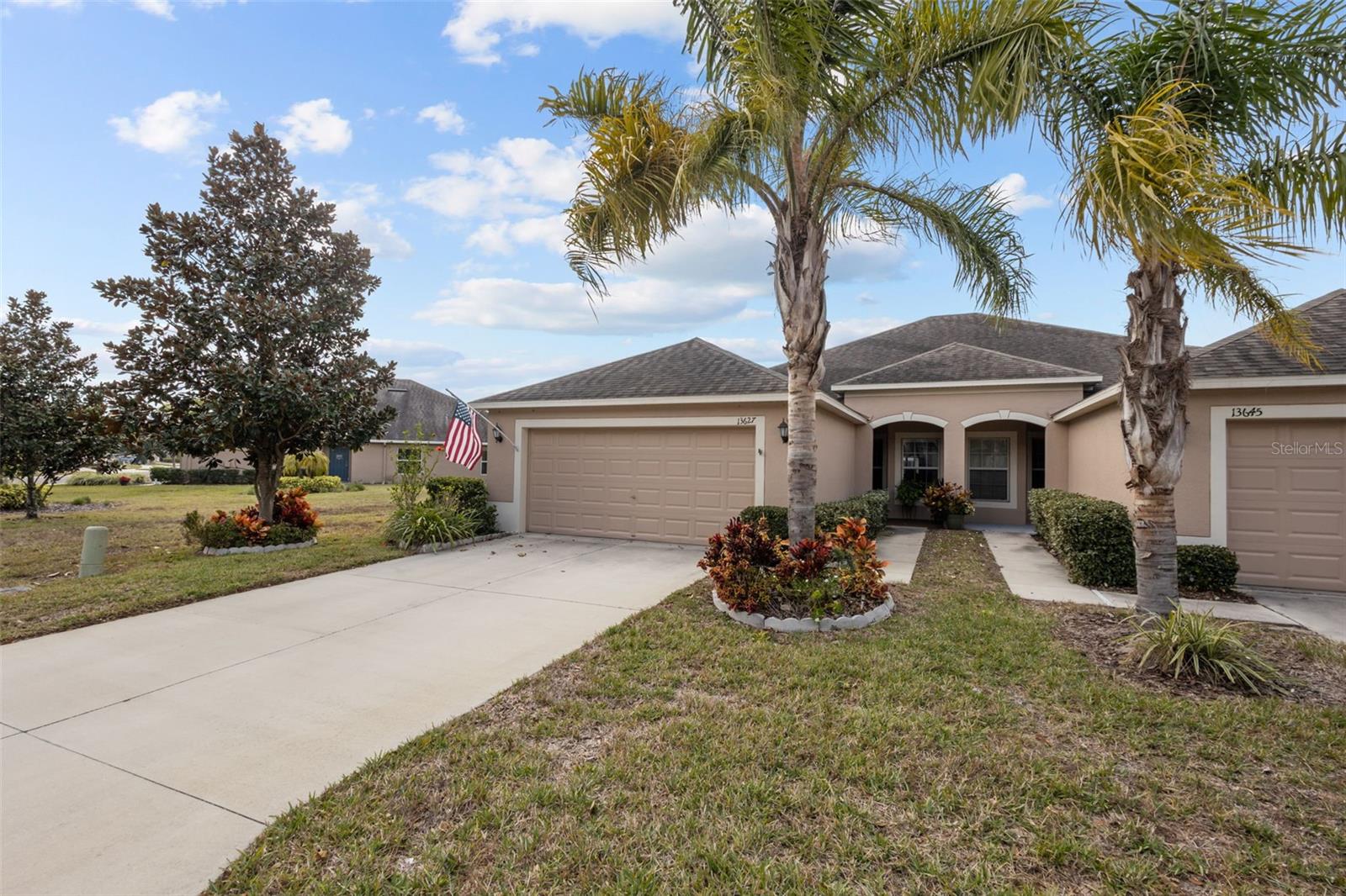 Nestled in the tranquil Lakeside neighborhood of Hudson, FL, this beautiful 3-bedroom, 2-bathroom villa on an oversized lot offers a perfect blend of comfort and modern convenience. Built just ten years ago, this low-maintenance home is ideal for those seeking a peaceful retreat with all the modern amenities. With three bedrooms and two bathrooms, this villa provides ample space for relaxation and entertaining. The home features tile flooring throughout and stunning wood flooring installed just three years ago. The kitchen boasts sleek granite countertops and a new glass backsplash, offering a contemporary flair and ample prep space for culinary enthusiasts. The owners have thoughtfully added cabinets to both the laundry room and garage, ensuring plenty of storage options. Double walls between units offer excellent insulation and soundproofing, ensuring a quiet and comfortable living environment. Equipped with hurricane shutters and double-paned windows, the villa is well-prepared for Florida’s weather conditions. The property’s oversized lot overlooks a serene pond, providing picturesque views and a peaceful setting. The Lakeside community offers a wealth of amenities, including a large resort-style pool, gym, common/game area, dog park, tennis courts, and basketball court. The Lakeside neighborhood is known for its tranquility, making it an ideal location for relaxation and enjoying nature. This villa is a perfect combination of comfort, modern features, and resort-style living. Don’t miss the opportunity to make this beautiful home your own! Contact us today for a viewing.