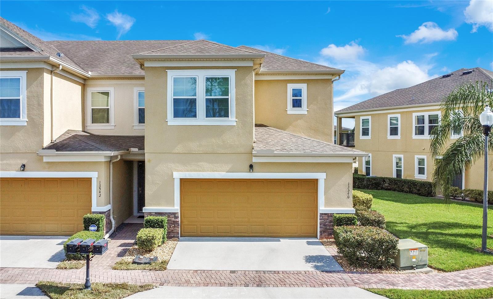 This is it! Welcome home to the Clermont Lake Lifestyle for under $400K. This gorgeous end unit with no front neighbor in 24/7 manned gated Magnolia Pointe (The "Fort Knox" of Clermont) combines low maintenance living and incredible private amenities with a fantastically convenient location. This 2016 built, move in ready gem feels bigger than it is because of all the windows and natural light flooding in the rooms. Downstairs the concept is open with the kitchen overlooking the huge family and dining room. There is also a half bath and a covered lanai to enjoy quiet mornings and afternoon sunsets. All the bedrooms are upstairs including the gigantic primary suite with a private balcony. Magnolia Pointe offers a private boat ramp into Johns Lake (one of the larger and quieter lakes), a community pool, tennis courts, covered playgrounds and clubhouse with fitness center and pool table. Close to the turnpike, Publix, Costco, countless restaurants and top tier medical facilities.