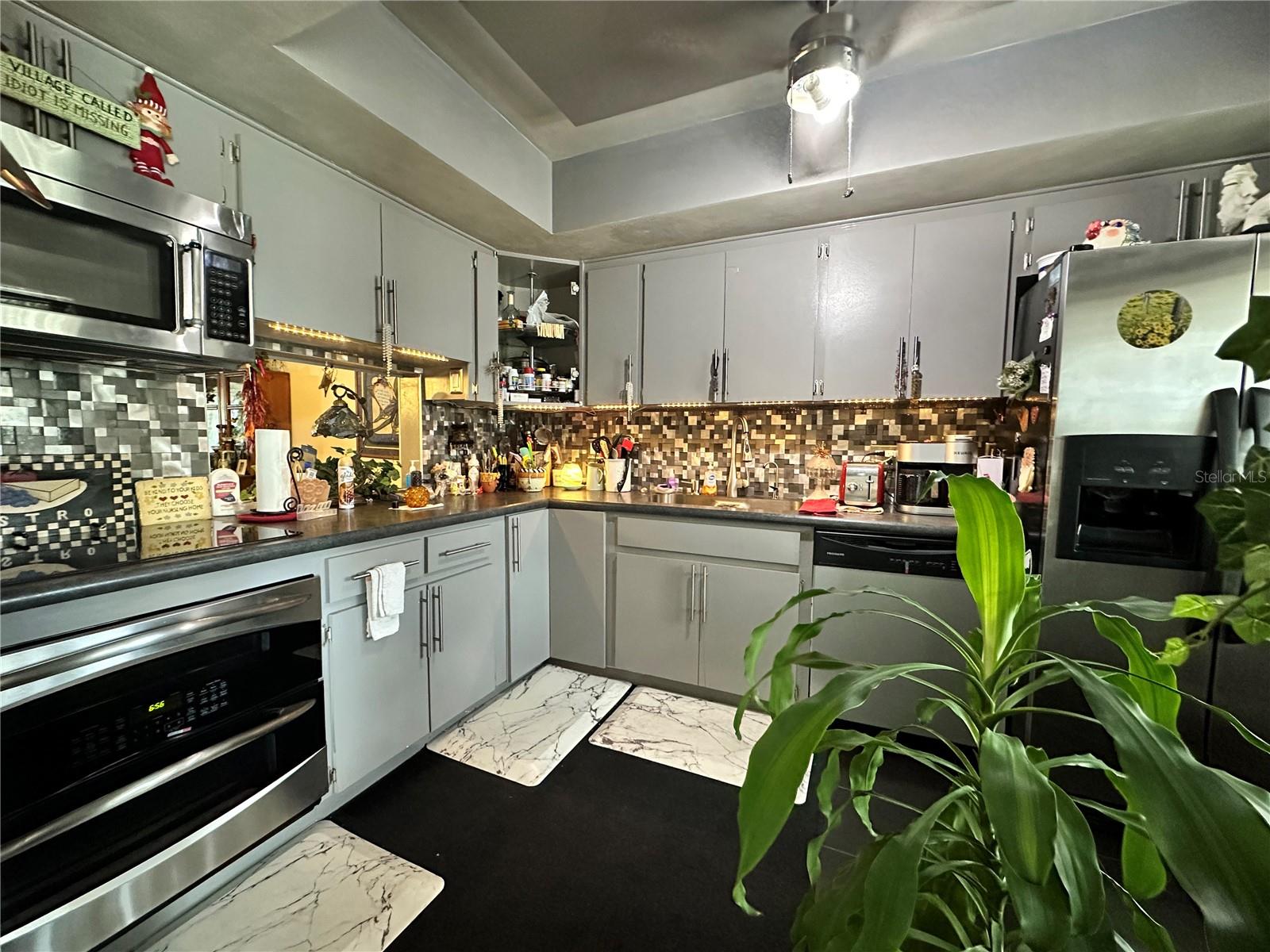 Welcome to this bright and beautifully updated 1-bedroom, 1-bathroom condo in the sought-after 55+ Barcley Estates community of North St. Pete. Situated on the second floor near the elevator, this condo offers privacy, charm, and modern convenience. Enjoy stylish features including solid wood cabinetry, elegant wood flooring, and updated tile in the kitchen and bath. The kitchen comes equipped with stainless steel appliances, and the unit includes a washer/dryer and built-in ironing board for added convenience. Barcley Estates is a well-maintained 36-unit community offering lush landscaped grounds, a large renovated pool (2021), a welcoming clubhouse, and shaded gazebos (2023). Recent building improvements include a new roof (2019), fresh exterior paint (2022), and elevator updates (2023). Centrally located near top shopping and dining, with quick access to downtown St. Pete, Tampa, and the Gulf beaches — this is Florida living at its finest. Assigned covered parking space. Schedule your showing today!