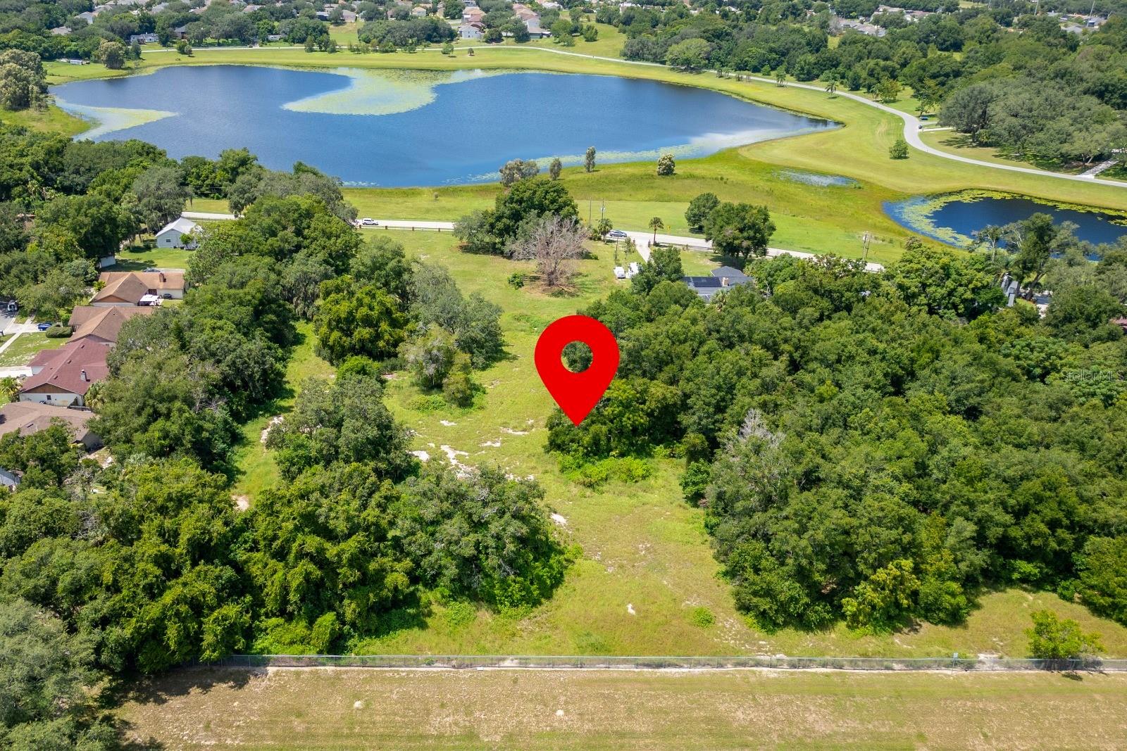 Exceptional investment opportunity at 1932 Good Homes Road in Orlando, Florida. This expansive 7-acre lakefront property, zoned R-1AA, offers immediate development potential in a high-demand area with no HOA restrictions. Its serene lakefront setting and generous acreage enhance long-term value and marketability, while the zoning provides a solid foundation for future planning. Positioned in one of Central Florida’s fastest-growing corridors, this property represents a rare chance to secure a high-impact asset with strong appreciation potential and attractive ROI in a thriving real estate market.
