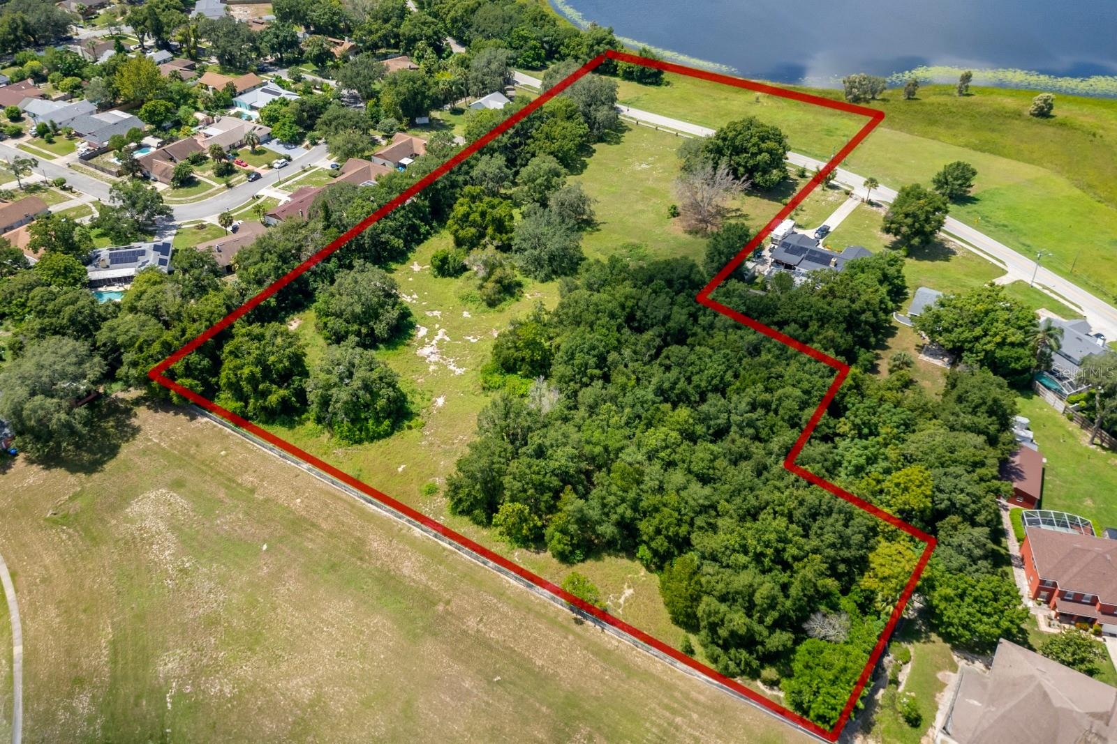 Exceptional investment opportunity at 1932 Good Homes Road in Orlando, Florida. This expansive 7-acre lakefront property, zoned R-1AA, offers immediate development potential in a high-demand area with no HOA restrictions. Its serene lakefront setting and generous acreage enhance long-term value and marketability, while the zoning provides a solid foundation for future planning. Positioned in one of Central Florida’s fastest-growing corridors, this property represents a rare chance to secure a high-impact asset with strong appreciation potential and attractive ROI in a thriving real estate market.