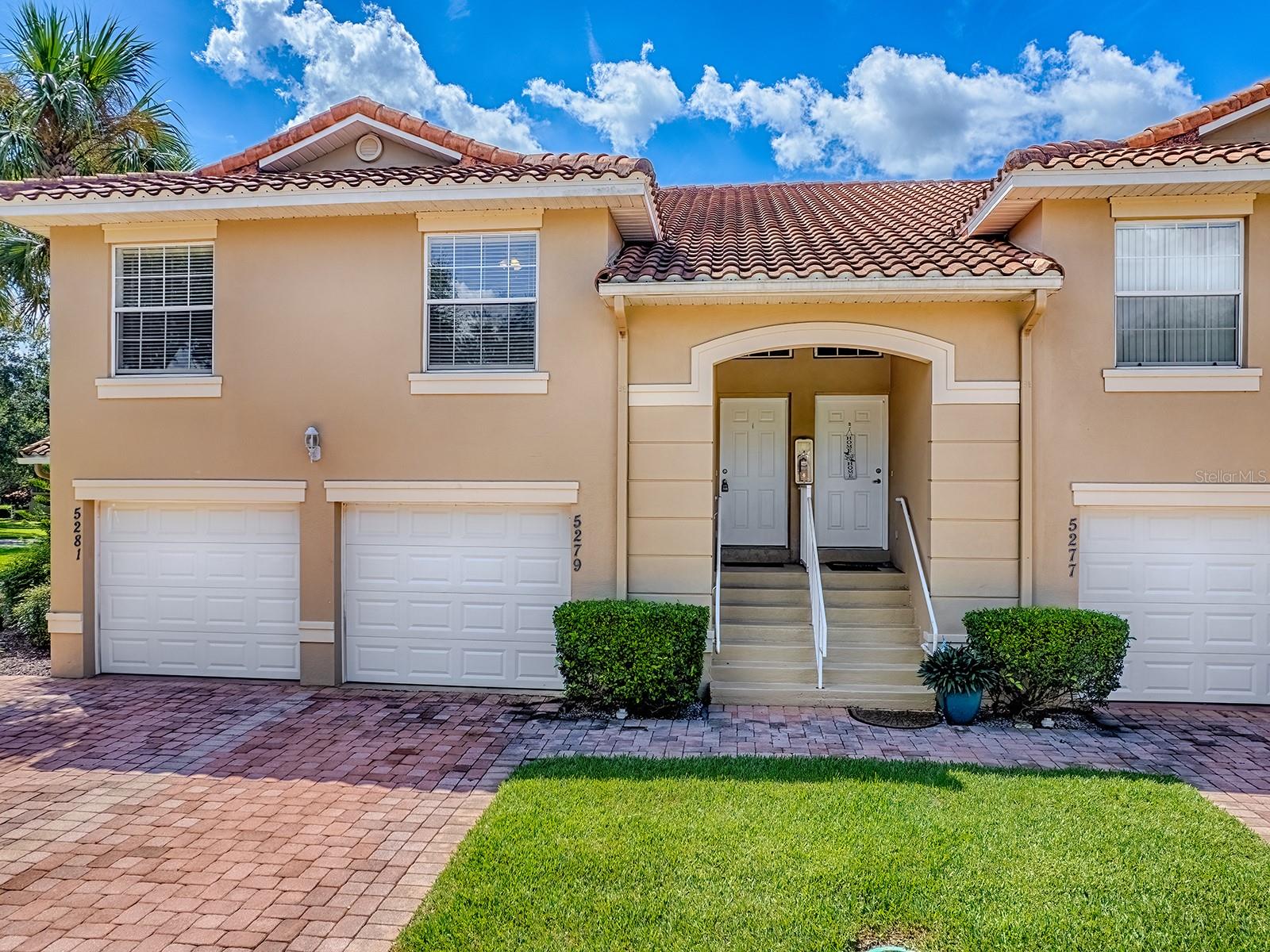 LAKESIDE LANDINGS highly sought-after 3/2 CONDO offers the ultimate in resort-style living with NO BOND! This beautiful, gated resort community is within seconds to The Villages, shopping, schools, and medical facilities … everything is close by. Spacious and open floor plan, your living room / dining room area has lots of NATURAL LIGHT with SLIDING GLASS DOORS leading to your balcony extending peaceful views. The KITCHEN has plenty of Cabinet & Counter Space and is open to the Main Living Area. LOFTY VOLUME CEILINGS, TILE FLOORING (IN THE MAIN LIVING AREA) AND AMPLE WINDOWS MAKE FOR LIGHT & BRIGHT LIVING SPACE. There is carpet in the PRIMARY BEDROOM, and an EN-SUITE PRIMARY Bathroom with DUAL SINKS AND A WALK-IN SHOWER! The GUEST BEDROOMS are on the opposite side of the Condo (one without a closet) and also have cozy carpet. The GUEST BATH features your TUB/SHOWER COMBO. The laundry closet is conveniently located in the hallway off the kitchen. The OVERSIZED 1 CAR GARAGE features a storage closet. A/C was replaced in 2021. BEST OF ALL, the landscaping and building maintenance is done by the Association. Owners are only responsible for interior maintenance. It will give you lots of time to enjoy the RESORT STYLE LIFESTYLE: GORGEOUS, LARGE COMMUNITY POOL with WATERFALLS & SPA, CLUBHOUSE with large multipurpose room with a stage, billiard room, card room, library, tennis and pickleball courts, putting green, playground AND lakeside CABANA and a FISHING DOCK, on BEAUTIFUL Lake Miona! There’s a public boat ramp just around the corner where you can put in your kayak, canoe, fishing boat, ski boat or just fish off the dock. THIS LOVELY CONDO MAKES FOR A TERRIFIC HOME AND/OR GREAT POTENTIAL AS AN INCOME PROPERTY.