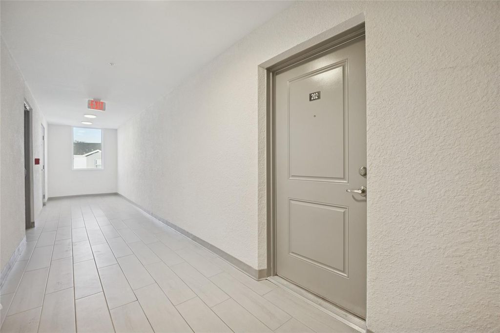 Photo of 1210 Southstation Place #202, Orlando, FL 32809 (MLS # O6366452)