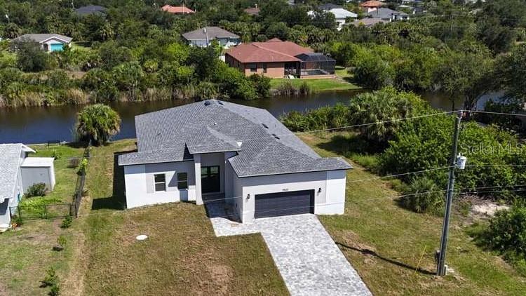 Photo of 9500 Galaxie Circle, Port Charlotte, FL 33981 (MLS # O6423006)