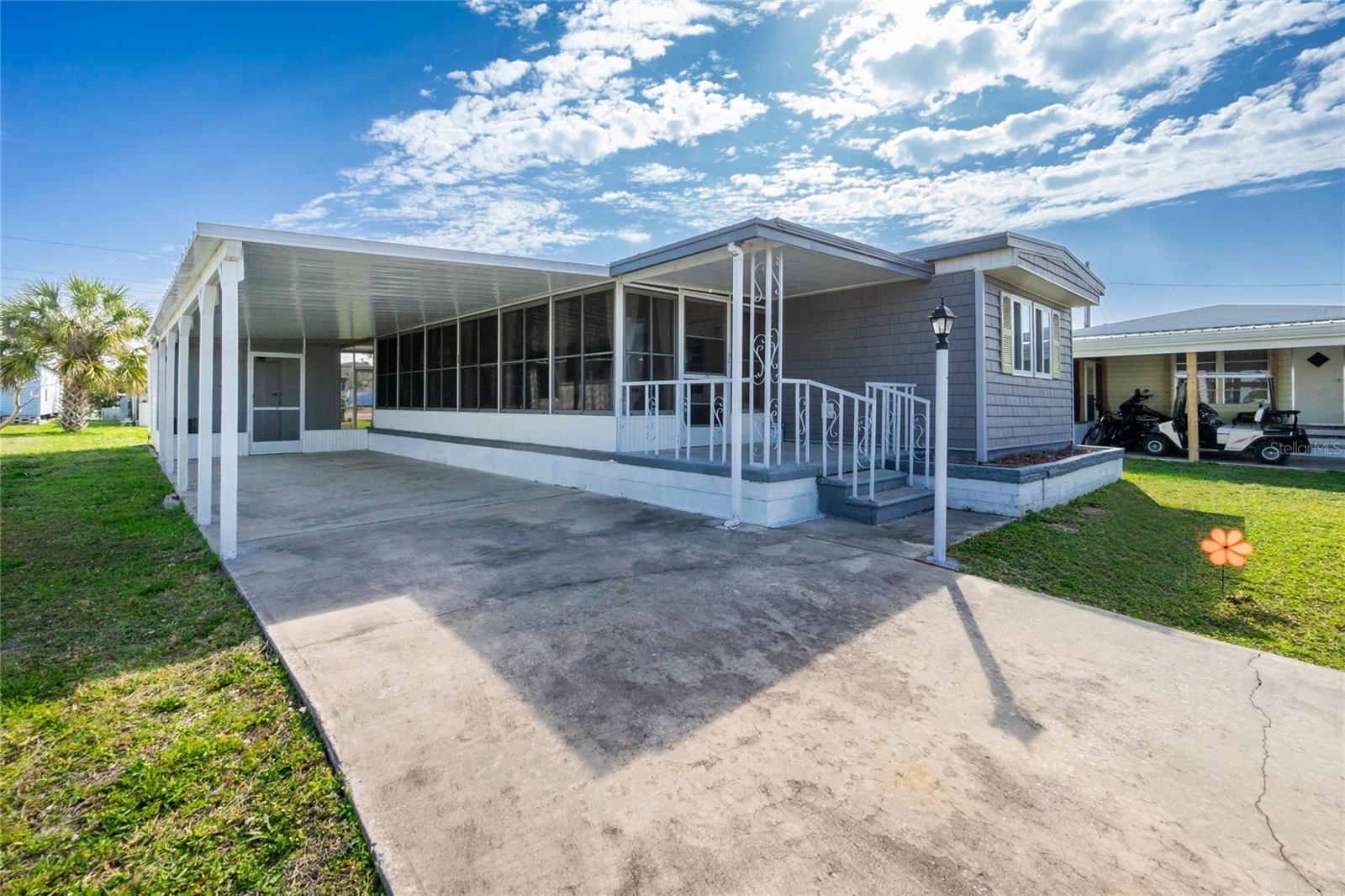 Discover the vibrant lifestyle of this thriving 55+ community for those seeking a dynamic and engaging environment! Situated in a waterfront community with direct access to the Gulf via rentable boat slips on the Myakka River, this is the epitome of Florida living. Indulge in the numerous amenities that make this community truly special. Two sparkling pools, tennis courts, bocce ball, a well-equipped gym, and a woodworking shop are just the beginning. Immerse yourself in a monthly calendar filled with exciting club activities – from the Boat Club, Golf Club to Bingo, A variety of card games, Billiards, and so much more. Nestled on a pet-friendly street, this charming home welcomes your fur baby (up to 25 pounds) to join the fun. The open-concept layout offers a welcoming space for entertaining and family visits. The large covered all-season porch surrounded by windows provides a comfortable additional living space. Step outside to your oasis, the back screened-in lanai is perfect for evening cocktails or morning coffee, an oversized driveway, and a covered parking lanai area with an extra storage closet with washer and dryer. Whether it's parking or entertaining, this space offers versatility and comfort. Rest easy knowing that this home weathered no hurricane damage. The community's prime location puts you just minutes away from historic Venice, the new Wellen Park, the Braves Stadium, pristine Gulf beaches, shopping, and delectable restaurants. Seize this opportunity to live where others vacation – your ideal Florida lifestyle awaits!