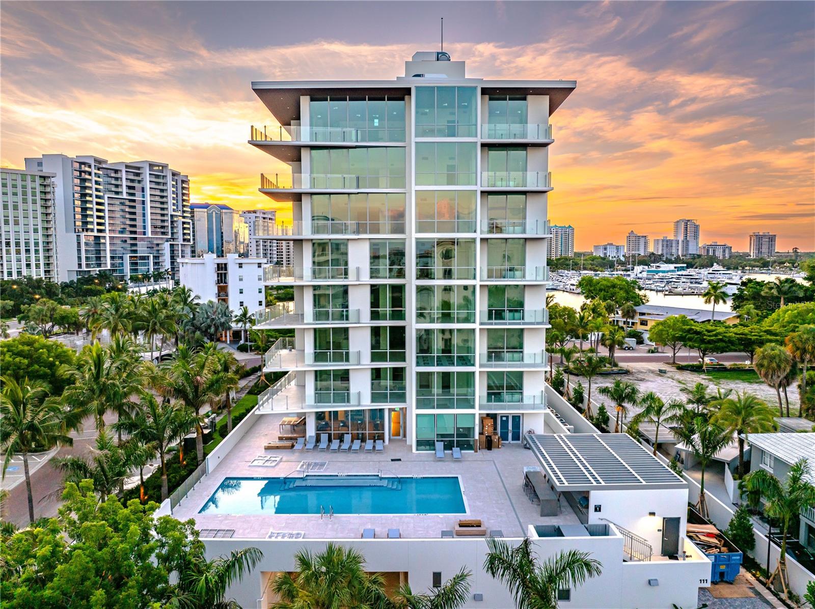 Move-In-Ready at The Evolution on Golden Gate Point—a boutique luxury community designed by Mark Sultana, DSDG. Welcome to Unit 201, where thoughtful design meets modern luxury in one of Sarasota’s most exclusive communities. This spacious residence features 2,505 sq ft of beautifully designed living space with 3 bedrooms, 3 baths and a large family room. Expansive stacking sliding glass doors in the living room lead to one of two private balconies, while the primary bedroom offers its own secluded outdoor retreat—both with serene west-facing views of tropical landscaping and the pool below. A deeded private 2-car garage provides added convenience and security. Situated on Golden Gate Point, The Evolution redefines boutique living with just 20 residences and resort-style amenities. Relax on the shared rooftop terrace, complete with panoramic views of Sarasota Bay, a spa, and a cozy outdoor fireplace, or unwind at the poolside outdoor kitchen. Stay active in the yoga room, gym, or sauna, and enjoy the ease of a full-time concierge service to assist with your daily needs. Beyond your home, Sarasota’s vibrant downtown awaits. From world-class arts and theater to renowned dining, boutique shopping, and breathtaking beaches, living here means embracing one of Florida’s most culturally rich and exciting cities. Unit 201 is move-in ready and waiting for you to enjoy the exceptional lifestyle Sarasota offers. Schedule your private showing!