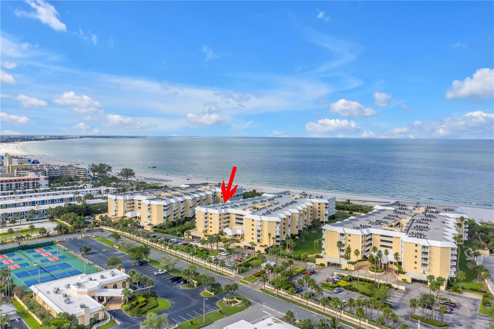 This 2 bedroom, 2.5 bath condo claims the top floor of the building, where your private balcony offers front-row seats to Gulf sunsets and a shoreline that stretches for miles. Morning coffee tastes better with the sea breeze, and evenings wind down effortlessly with a glass of wine and that endless horizon. Inside, the unit has been impeccably cared for — clean, solid, and move-in ready, with plenty of opportunity to personalize. The floor plan is generous and functional, offering two spacious bedroom suites, a powder room for guests, and an interior laundry area for convenience. Life here is more than just your typical beach condo: take a dip in one of two waterfront heated pools, soak in the spas, challenge friends to a game on the tennis or pickleball courts, or unwind in the clubhouse just steps from the sand. Residents also enjoy a well-equipped fitness center, on-site management, secure gated entry with 24/7 guards, and a private garage space. When it’s time to head out, you're minutes from local favorites like Grove Surf & Coffee, Chill Restaurant, Boulevard Burgers, and La Casa Del Pane — all just steps away. Downtown St. Pete is 20 minutes by car, and both Tampa International and St. Pete–Clearwater airports are within a 30–40 minute drive, making travel seamless. Whether you’re drawn to the potential of a renovation or the promise of Gulf-front serenity, this rarely available top-floor condo offers the space, the view, and the lifestyle to make it your own.