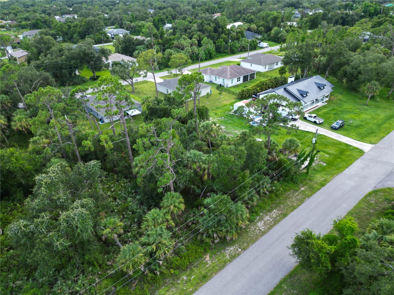 This vacant lot is tucked away in North Port, yet it’s just minutes from I-75, making trips to Sarasota, Venice, Port Charlotte, or even Naples quick and convenient. You’ll also be just a short drive from Wellen Park, a new community full of shops, dining, parks, walking trails, live entertainment, and the Atlanta Braves Spring Training stadium.The City of North Port continues to pop with new homes, schools, and businesses, which makes this the perfect time to secure your piece of land here in Sarasota County. With no HOA restrictions, you’ll enjoy the flexibility of designing your dream home, plus you’re close to Gulf beaches, golf courses, and beautiful nature preserves! Whether you’re dreaming of building your forever home or looking for a smart investment, this location checks all the boxes. And if you’d like assistance on the building process, our trusted custom home builder is available to walk you through every step and answer your questions!