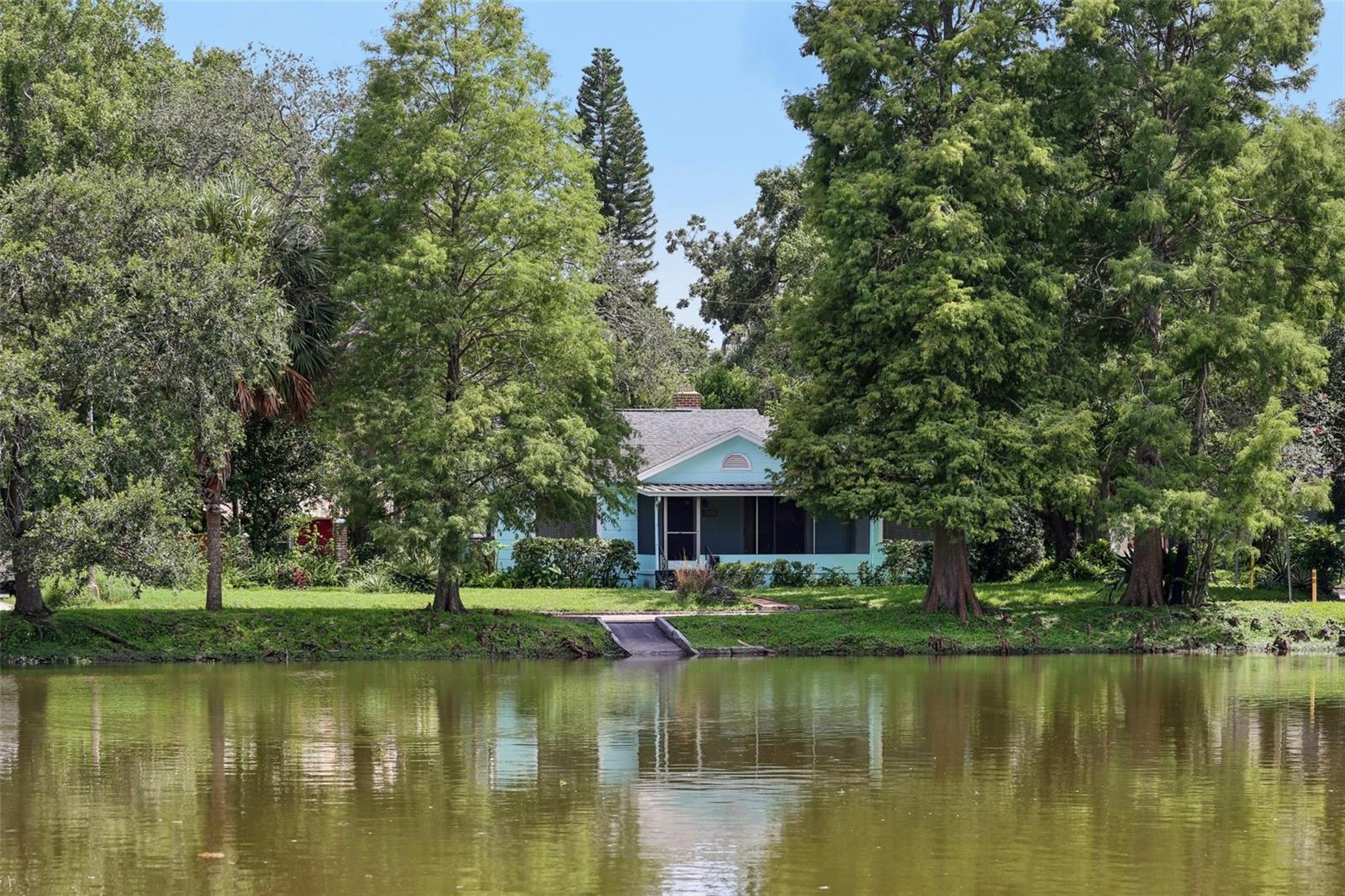 Fairytale living in the heart of historic Seminole Heights!
Welcome to 5803 Roberta Circle—an incredibly rare opportunity to own a prime corner lot directly overlooking Lake Roberta, the iconic centerpiece of the beloved Hampton Terrace Historic District. This charming bungalow offers one of the most coveted settings in Seminole Heights, where neighbors stroll around the lake, wave from front porches, and celebrate the seasons with festive block parties, hayrides, and holiday lights.
This home invites you in with timeless charm and vintage character, featuring original red oak hardwood floors, decorative cove ceilings, and a tiled bathroom with updated fixtures, thoughtfully preserved to honor the home’s history. The sunny kitchen blends old and new with butcher block countertops, a gas range, updated stainless steel sink, and a modern Samsung refrigerator.
The floor plan includes two spacious bedrooms and a versatile flex room that can serve as a third bedroom, office, playroom, or creative space—perfect for today’s live-work lifestyle. Enjoy cozy mornings or quiet evenings from your rescreened front porch, gazing out across the water as ducks pass by and neighbors say hello.
Outside, the backyard offers a large potting shed to garden. There’s also a detached two-car garage with workshop, providing extra space for hobbies or storage.
Big-ticket upgrades are already done for you, including a NEW ROOF (2020), new exterior paint (2020), new plumbing and water heater (2020), and front porch rescreened (2025).
Location is everything—and this home puts you in the center of it all. You’re just minutes to Downtown Tampa, Riverwalk, Armature Works, Ybor City, the Zoo, Stadium, Channel District, and Tampa’s top restaurants, breweries, shops, and cafes. Walk to Publix or bike to morning coffee. Whether you’re a young professional, couple, or growing family—this is where city life meets neighborhood soul.
Don’t miss your chance to live in one of Tampa’s most treasured communities. Schedule your private showing today and fall in love with life at Lake Roberta.
