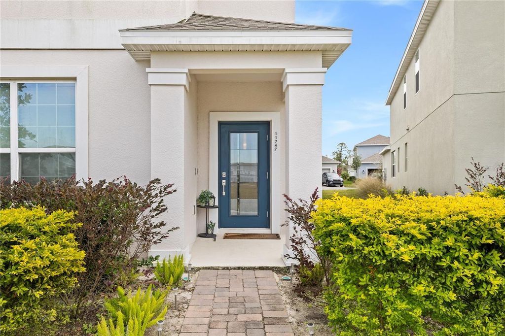 Photo of 11747 Apostrophe Alley, Orlando, FL 32832 (MLS # O6394960)