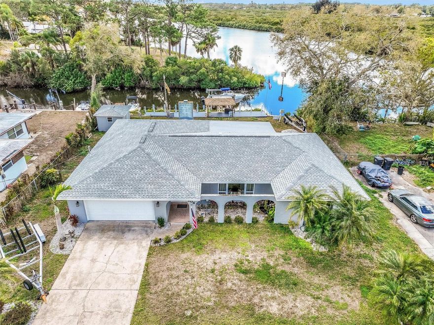 Enjoy true Florida waterfront living in this updated 3-bedroom, 2-bath canal-front home on the peaceful Braden River with quick boating access to
Terra Ceia Bay, Tampa Bay, the Gulf, and the Intracoastal Waterway. Designed for boating enthusiasts, the property features a 59-foot Trex dock
with a private 13,000 lb boat lift (boats sold separately) and a dedicated launch area for kayaks and jet skis. A newly built riverside tiki bar with
power and water creates the perfect space for outdoor entertaining. Inside, the home offers an open floor plan with a split-bedroom (bedrooms
have new carpet March 2026) layout and an upgraded kitchen featuring solid maple cabinetry, quartz countertops, and a pass-through bar ideal
for indoor-outdoor gatherings. The living area with a brick-accent fireplace opens to a screened lanai spanning the rear of the home, where
relaxing water views and beautiful sunsets can be enjoyed. Built with concrete-block construction, the home includes a new roof (2023), new
windows, and polycarbonate hurricane shutters for added peace of mind. Located near the end of a quiet cul-de-sac with no HOA or CDD fees,
the property also features a fully fenced backyard, a 10x10 detached workshop, space for RV or boat trailer parking. NO STORM DAMAGE to this residence.  Convenient to I-75, shopping, dining, and the UTC area, this move-in-ready waterfront property is ideal as a primary residence, vacation
home, or investment opportunity. NO HOA! ROOM FOR A POOL!