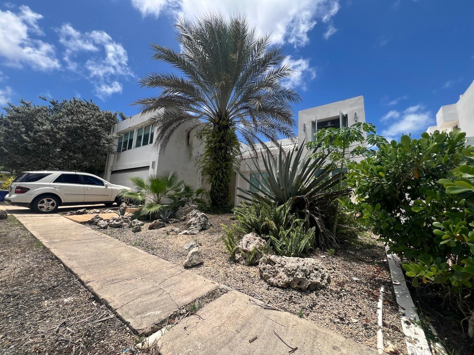 Coming Soon: In Estancias de Torrimar, Guaynabo, lies this majestic residence in one of Puerto Rico’s most exclusive gated communities, featuring double controlled access and top-level security. The property offers 5 spacious bedrooms, 5 bathrooms, living room, dining room, family room, wine cellar, modern kitchen, laundry room, a concrete terrace ideal for entertaining, a private pool, and a two-car garage. Living in Guaynabo means exclusivity and convenience, surrounded by prestigious schools such as Baldwin, Marista, and Rosa-Bell, as well as upscale shopping centers like San Patricio Plaza and The Mall of San Juan, along with a wide selection of gourmet and international restaurants. Its strategic location allows residents to enjoy a vibrant lifestyle, with proximity to hospitals, supermarkets, and main access routes to San Juan and the metropolitan area. A unique opportunity for those seeking luxury, comfort, and the best quality of life on the Island.