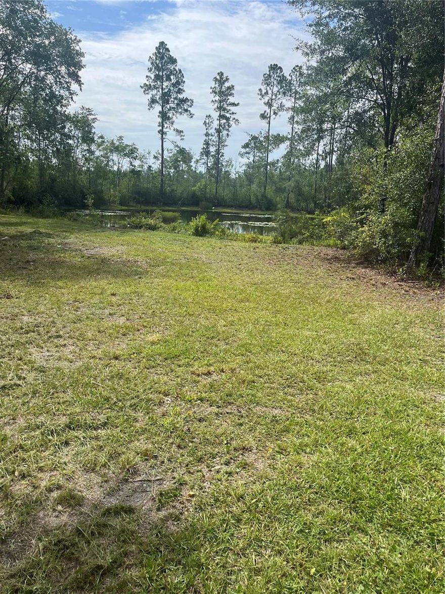 Discover the perfect blend of peace, privacy, and convenience with this well-kept 0.77-acre parcel located in beautiful Baker County, Florida. This spacious lot comes equipped with a private well, septic system, and electricity available at the road, making it suitable for all of your needs. One of the standout features of this property is the serene pond, offering a picturesque view and a tranquil atmosphere right in your own backyard. The land is cleared and usable, providing a great head start whether you're ready to build or simply invest in Florida land. Situated in a quiet rural setting, yet within easy reach of local roads and amenities, this parcel offers the ideal combination of country living and accessibility. Don’t miss the opportunity to own a piece of Florida paradise that’s ready for you to make it your own.