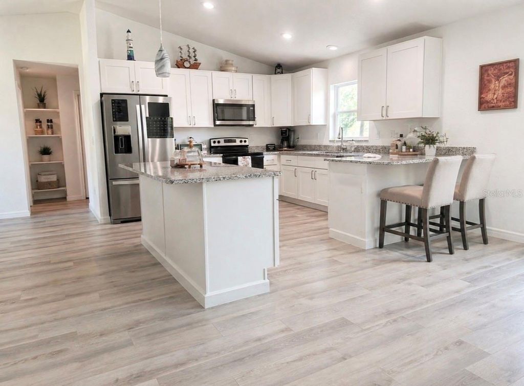 Photo of Ocklawaha, FL 32179 (MLS # OM723596)